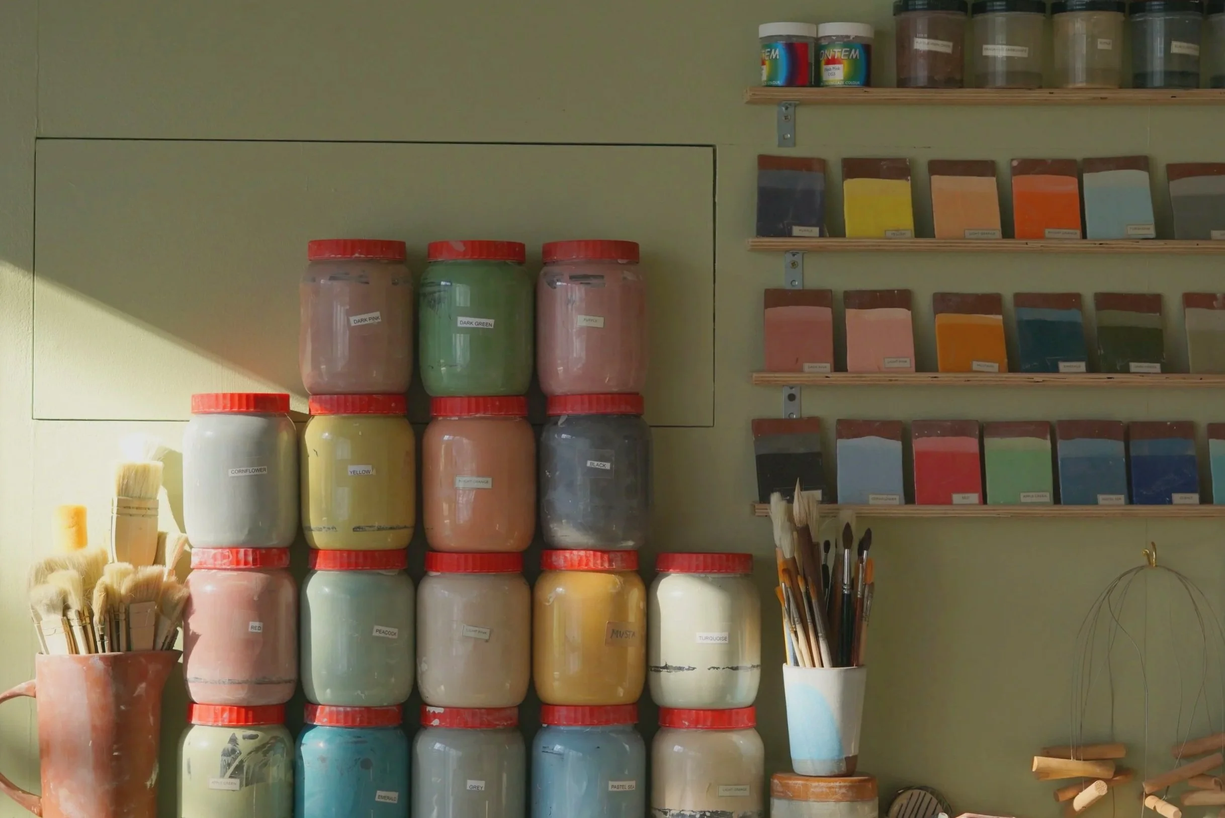 Ceramics class setup with tools and clay ready for participants