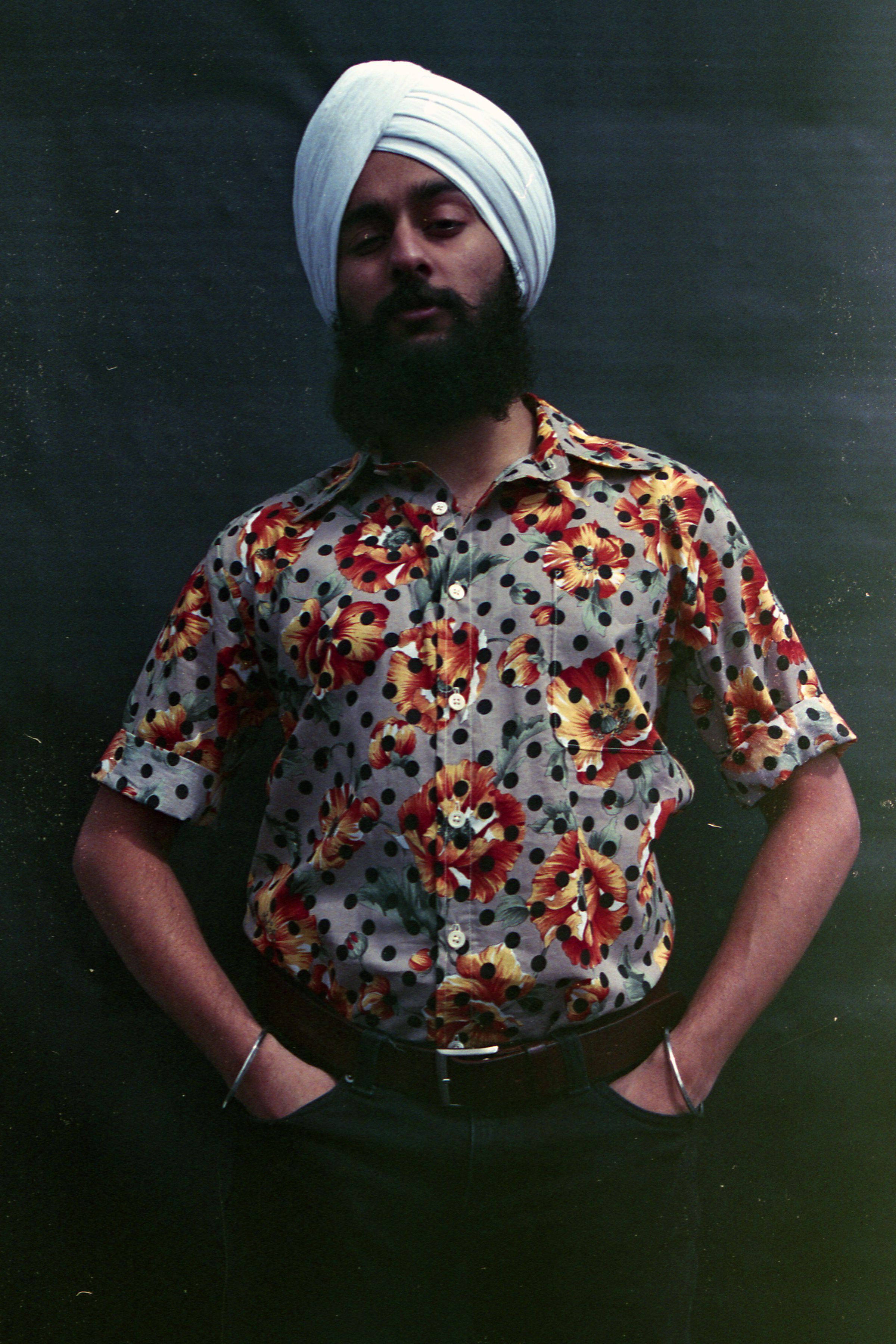 Closeup of model wearing the Polka Dot Floral Summer Shirt by Slow Process