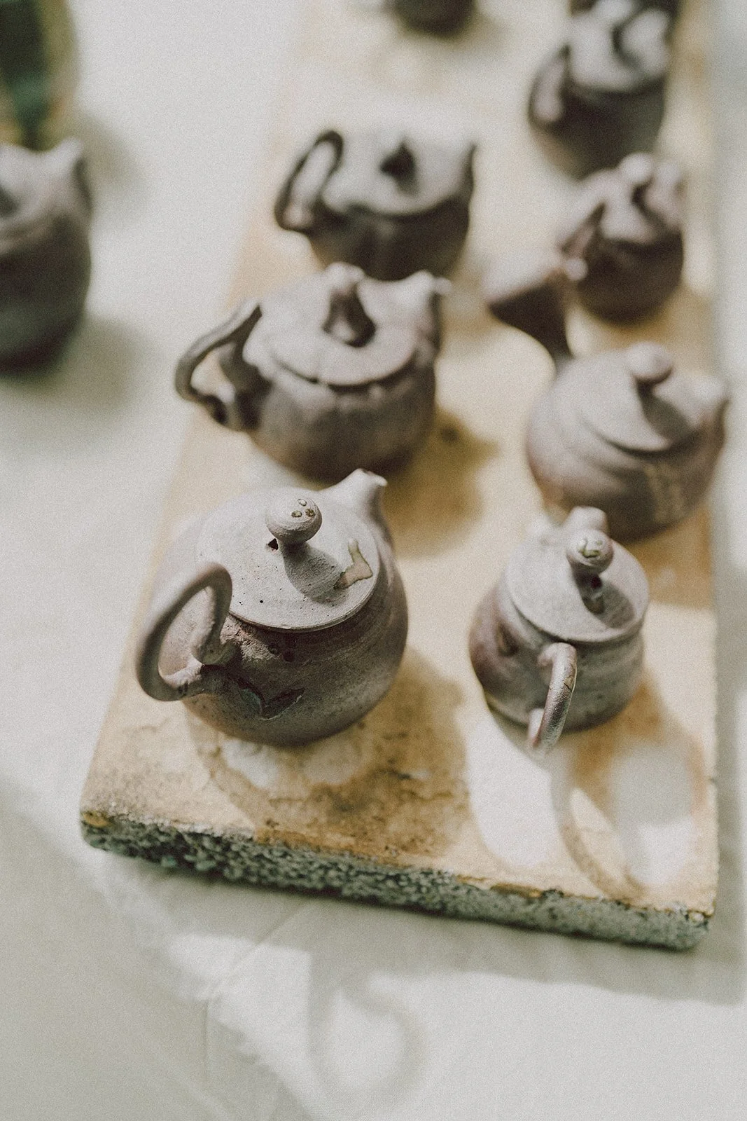 A variety of teapots on display while vending at the 2024 Northeast Tea Expo
