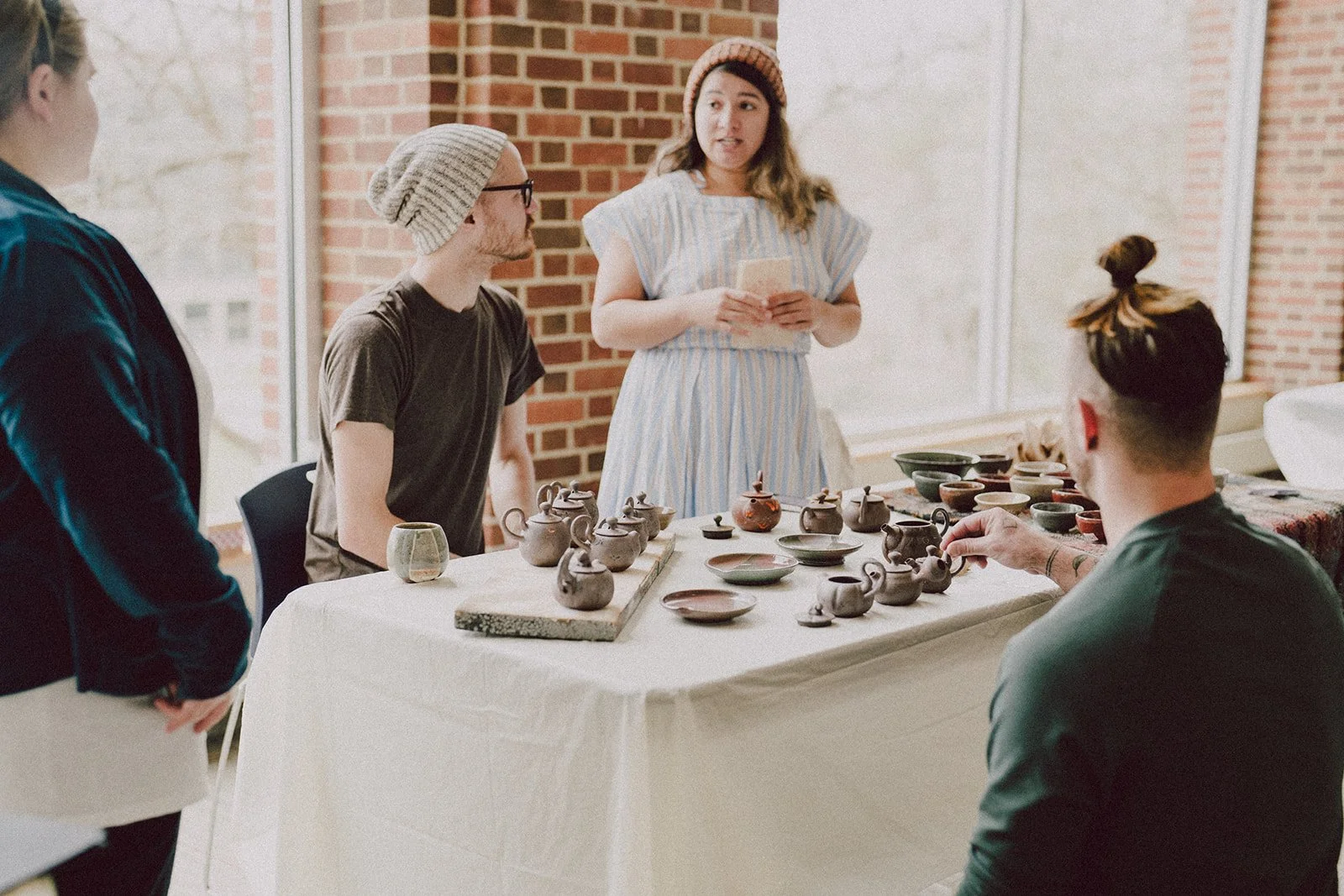 People looking at variety of teaware while vending at the 2024 Northeastern Tea Expo, Penn State