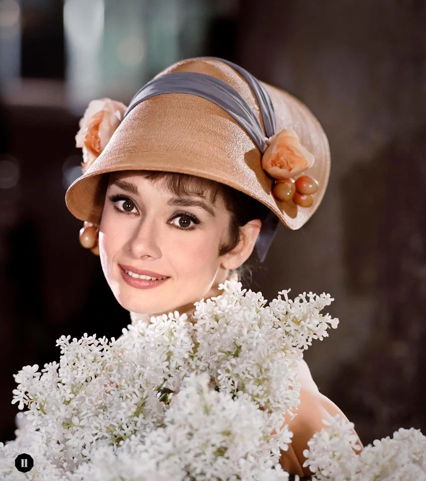"Are there lilac trees in the heart of town?": Audrey poses with white lilacs for My Fair Lady, 1963 ©BOBWILLOUGHBY