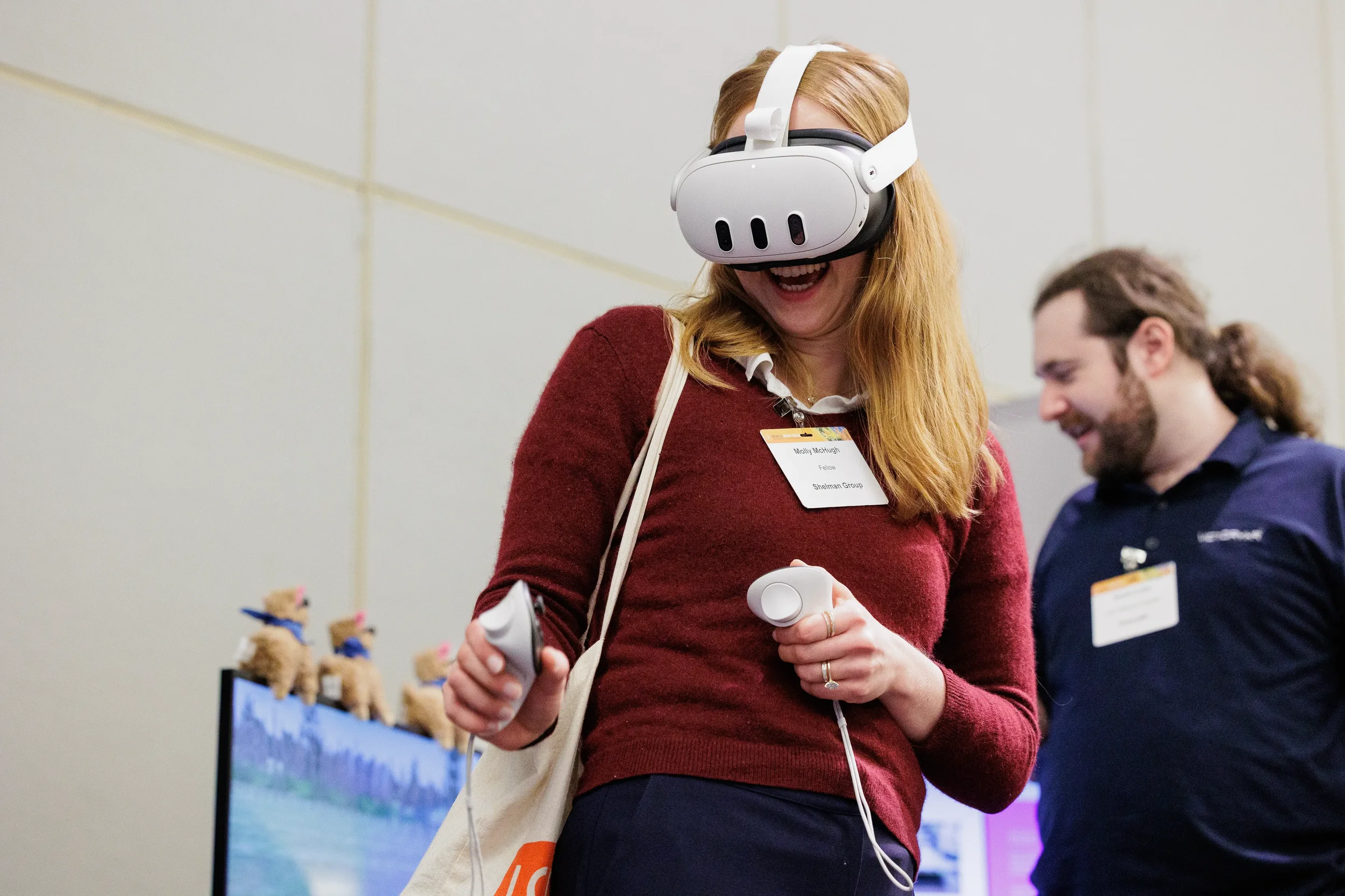 Attendee laughs while trying virtual reality headset demo at Chicago corporate event booth
