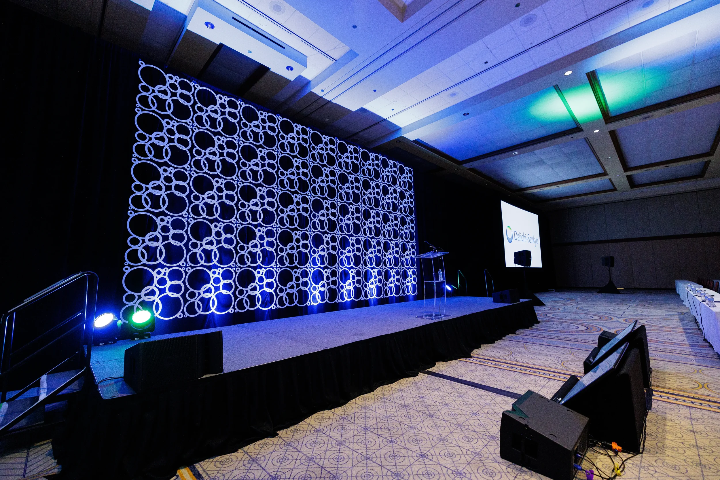 Empty stage with branded circle backdrop set up for Chicago corporate conference
