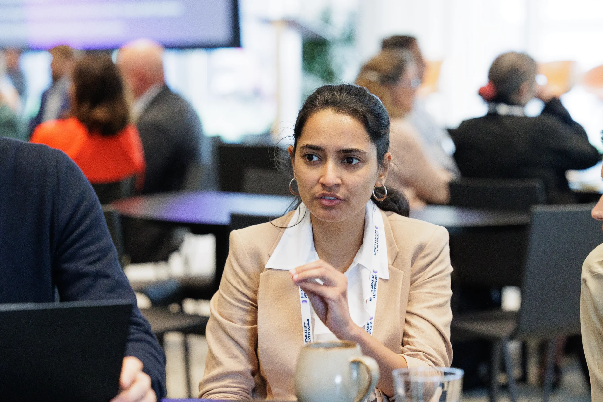 Attendee engages in conversation during break at Chicago industry conference