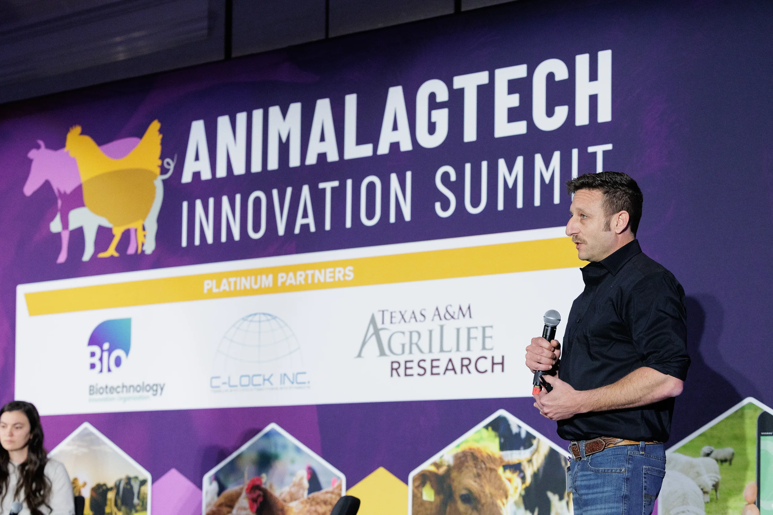 Speaker addresses audience from stage during Orlando corporate event general session