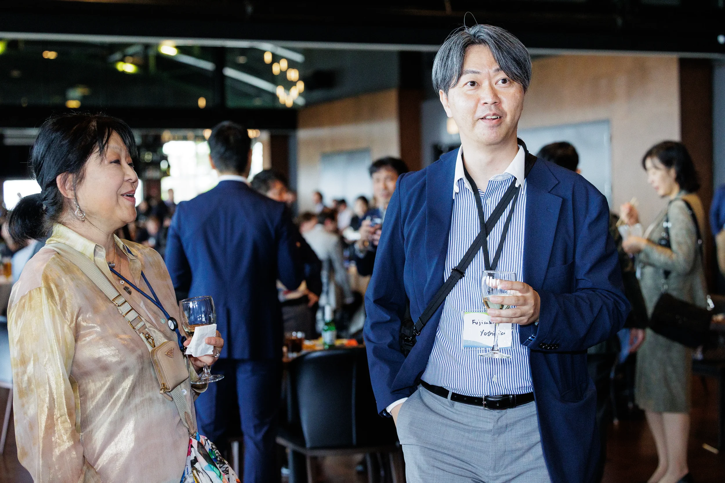 Attendees converse with drinks in hand while networking at Chicago corporate event