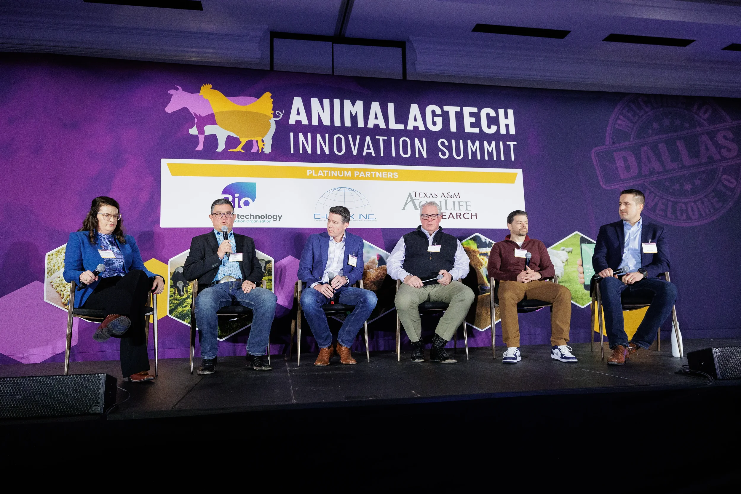 Six panelists discuss on branded stage during session at Orlando industry summit
