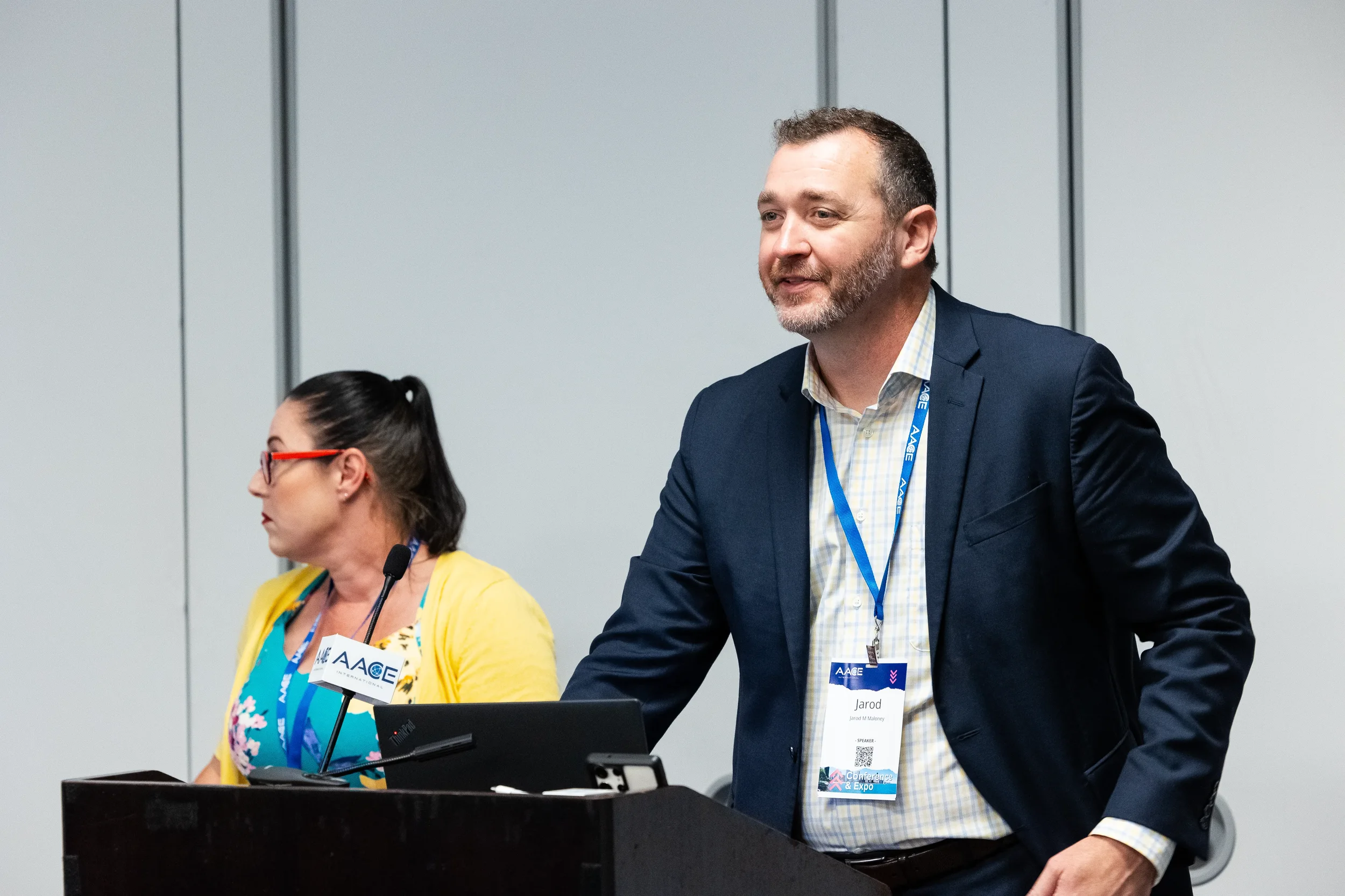 Presenters deliver breakout session from podium at AACE International conference in Chicago