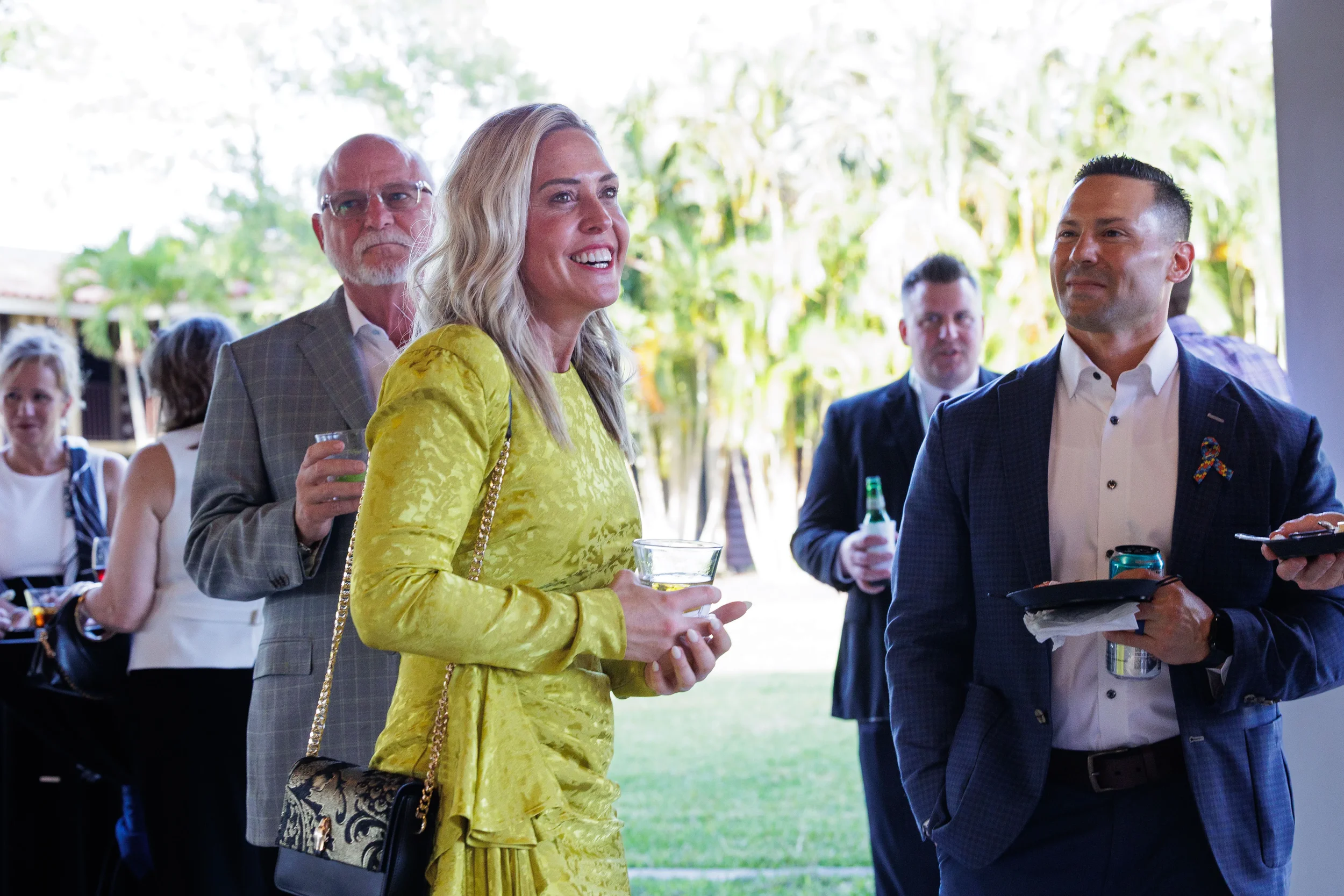 Attendees in formal attire enjoy cocktails at outdoor evening reception at Chicago corporate event