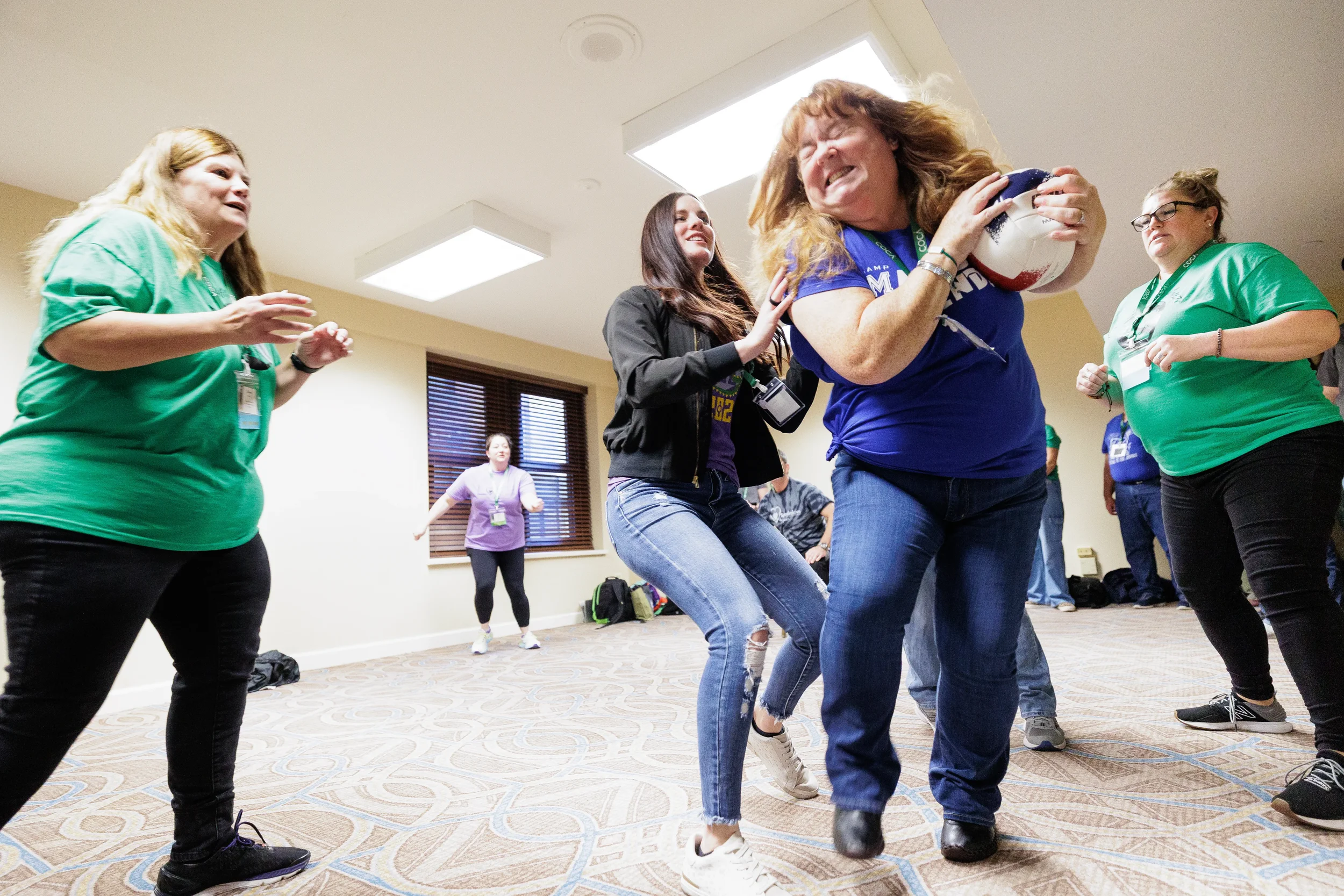 Attendees laugh and compete during high-energy team building game at Chicago nonprofit conference event