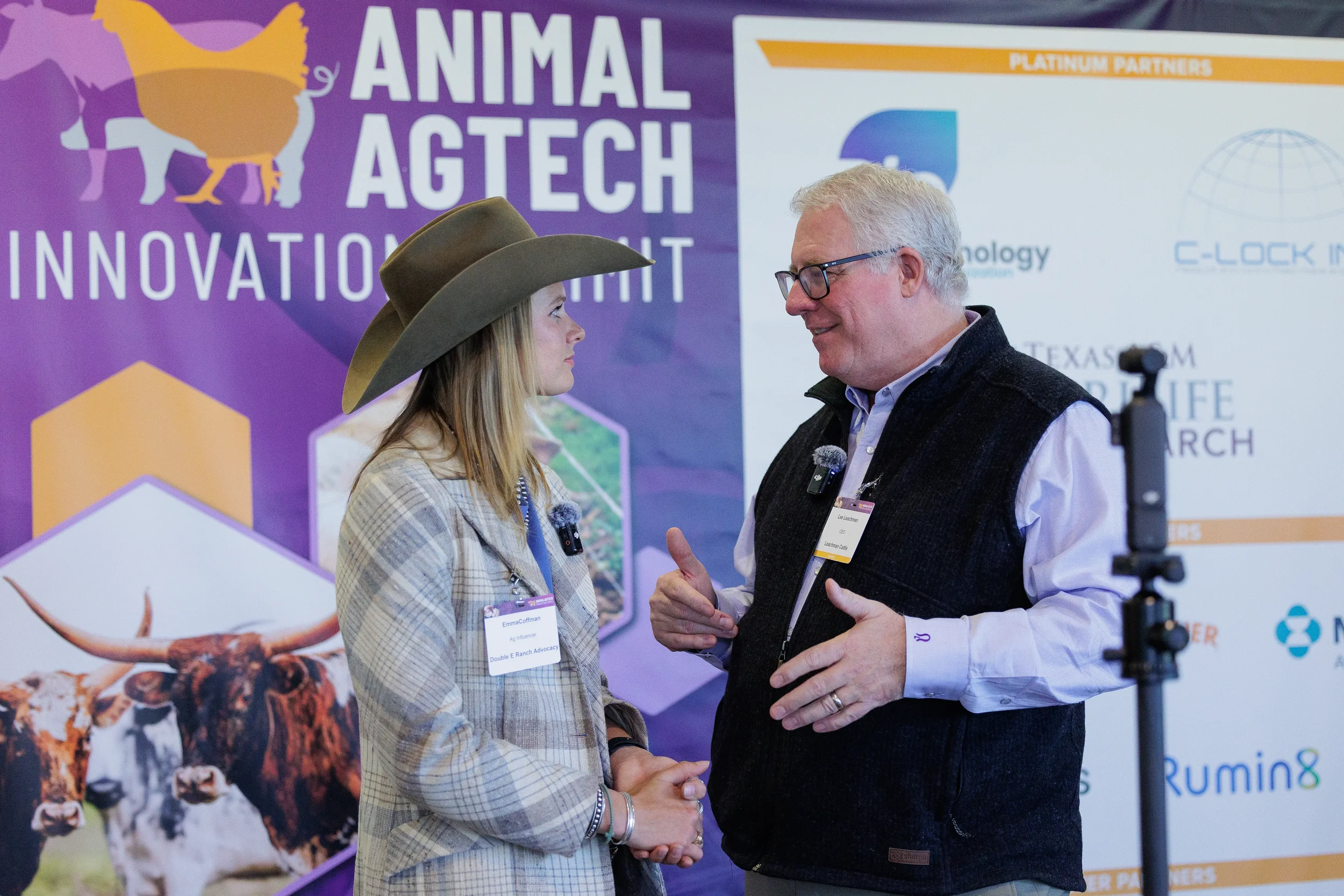 Attendee wearing cowboy hat is interviewed on camera at Orlando industry conference
