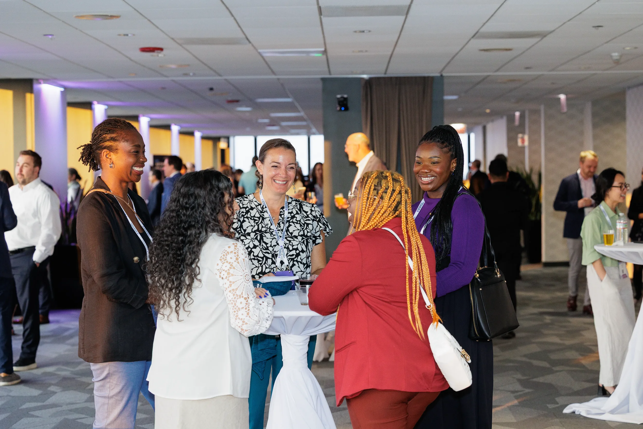 Group of attendees smile and network together during Chicago corporate event reception