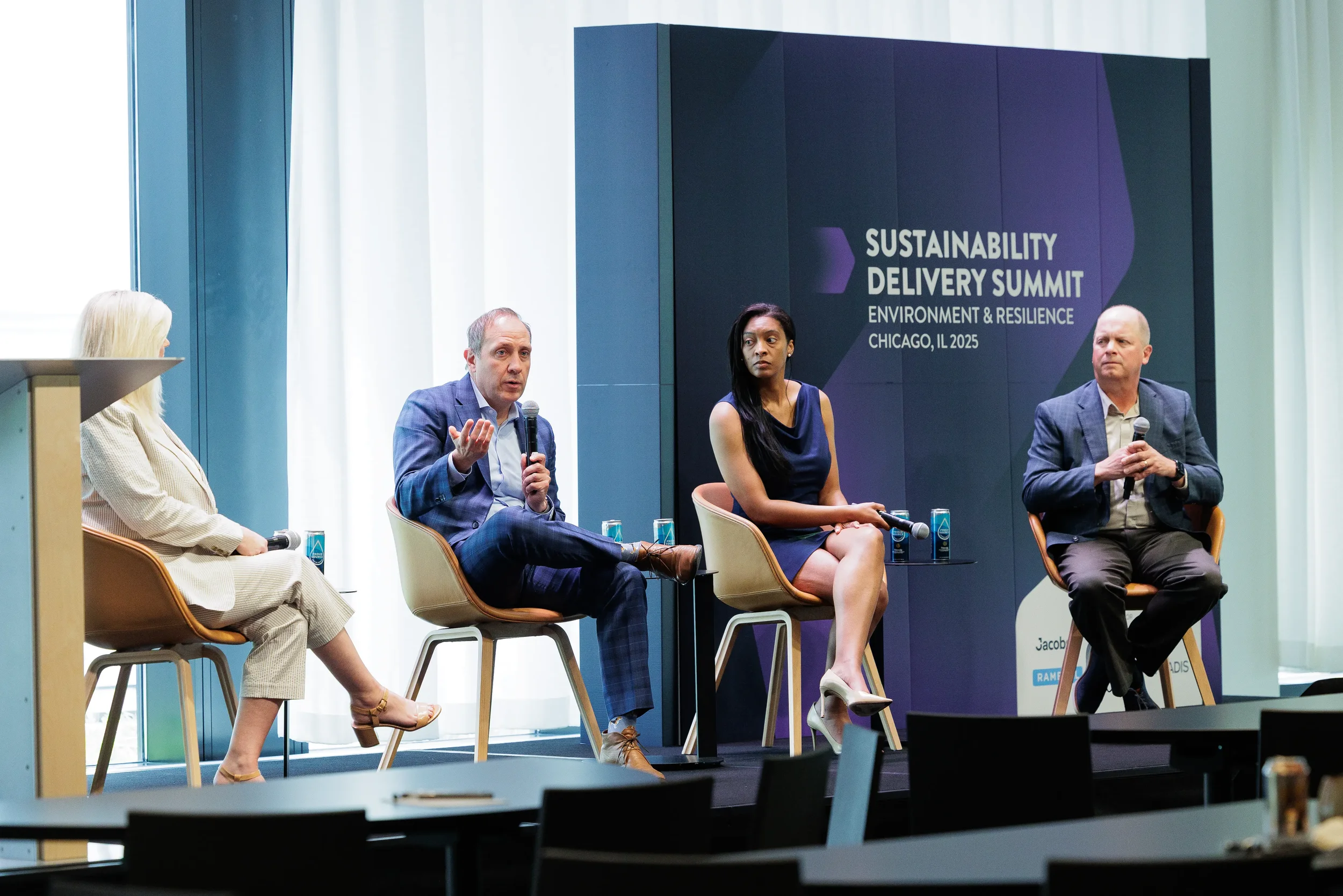 Four panelists discuss environmental topics on stage at Chicago industry conference