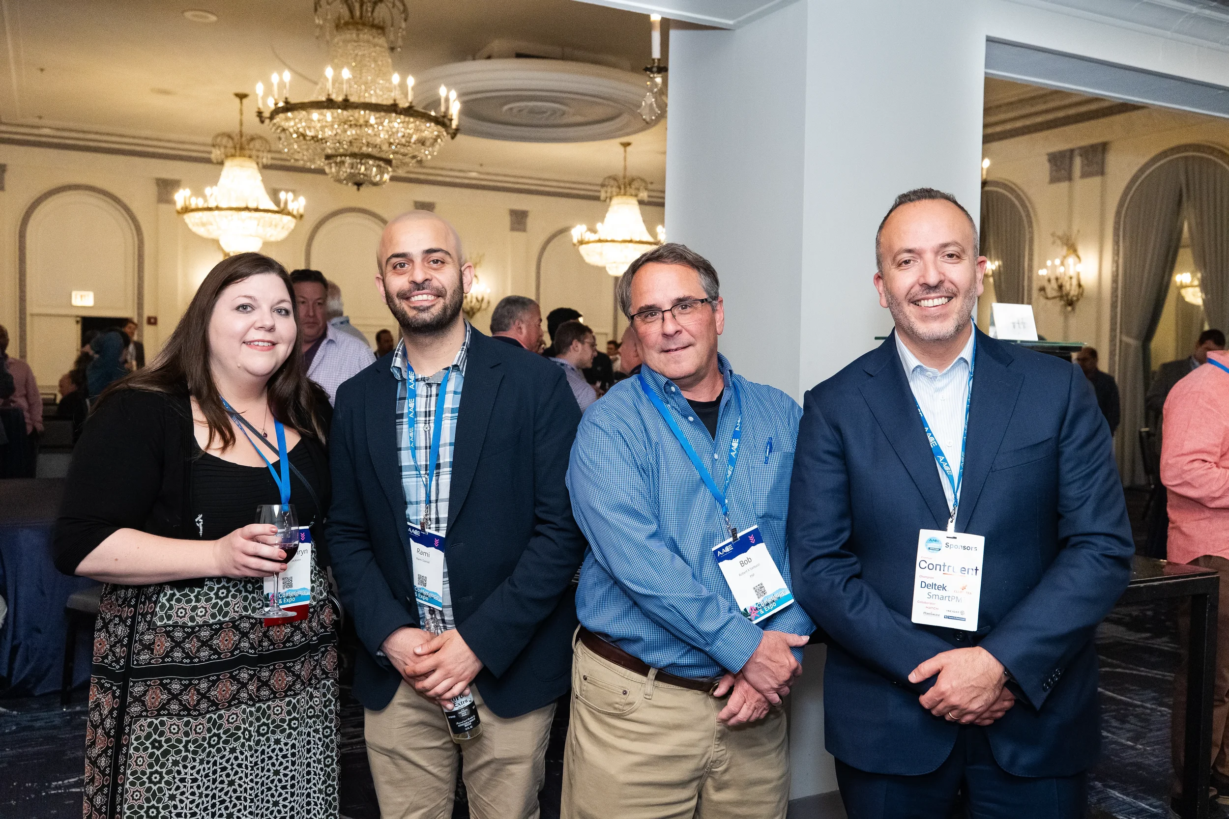 Four conference attendees posing for group photo at Orlando networking reception