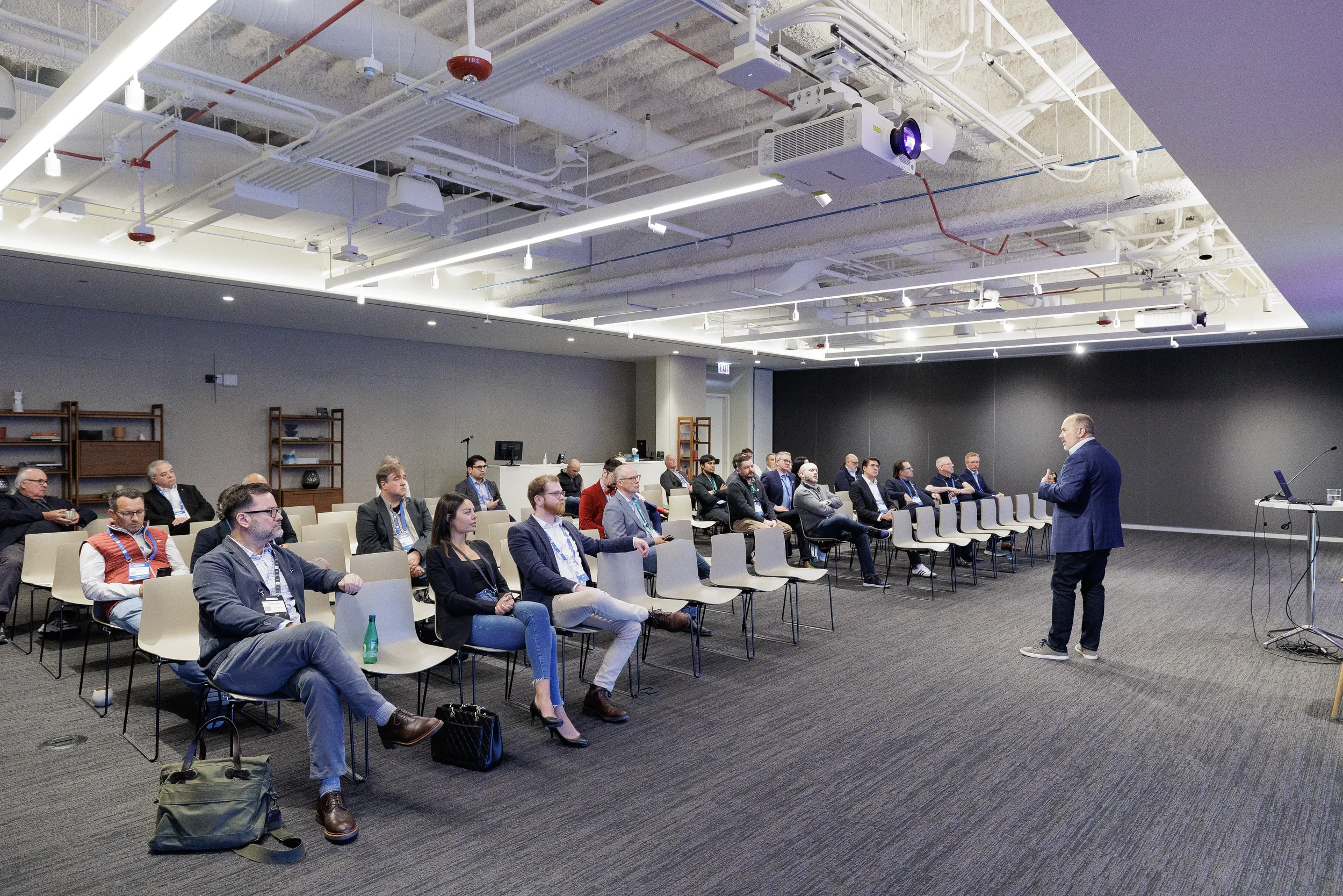 Speaker addresses seated audience in breakout session room at Chicago corporate conference