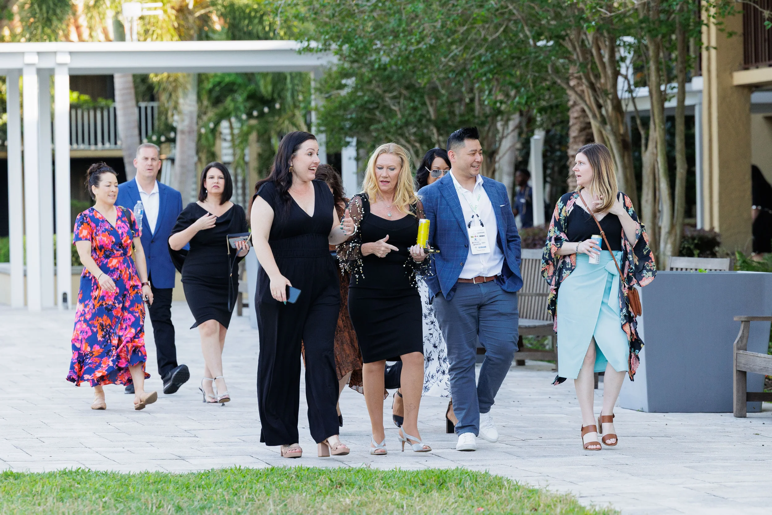 Group of attendees walk and converse through outdoor courtyard at Chicago industry conference