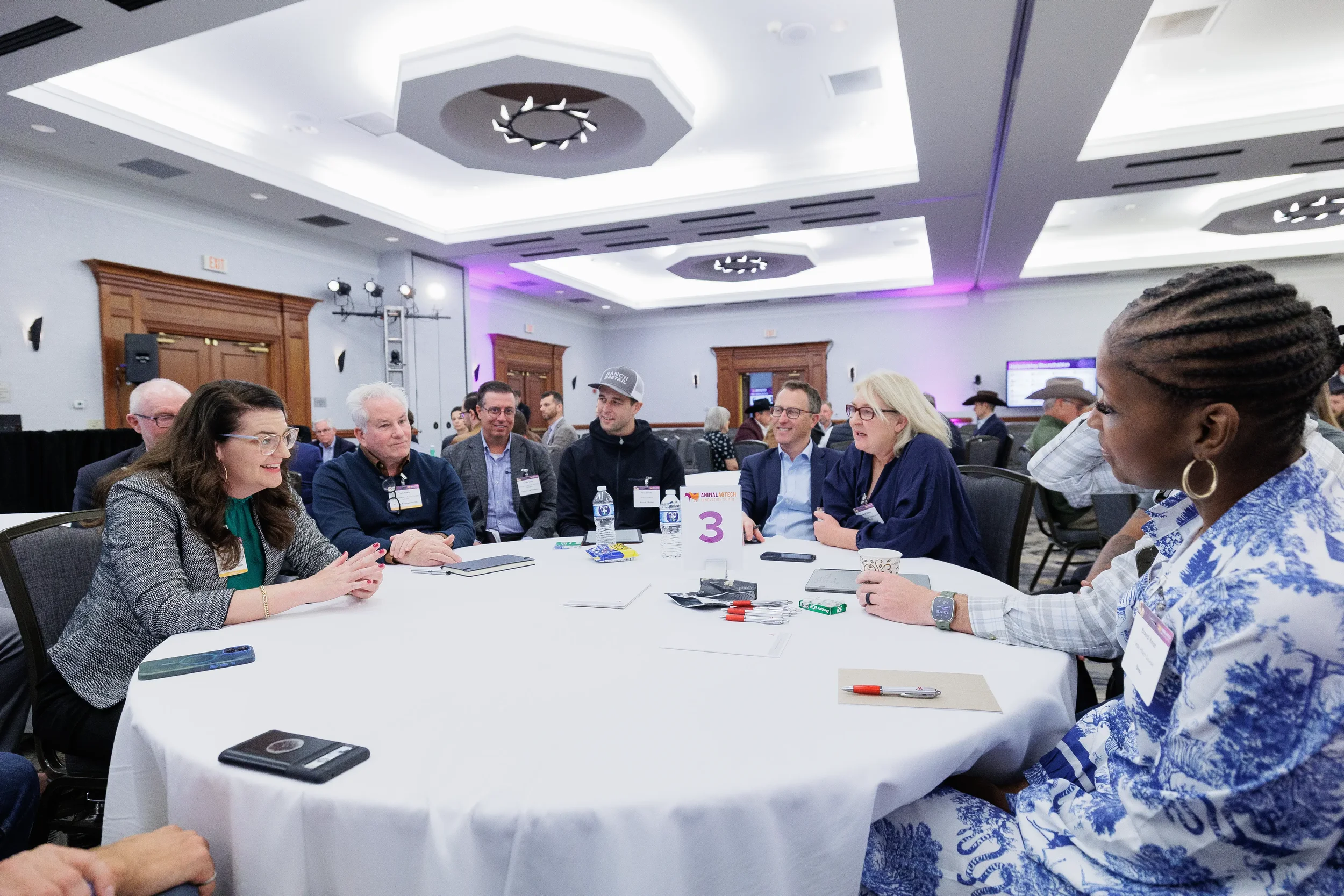 Group of attendees engage in roundtable breakout discussion at Chicago industry conference