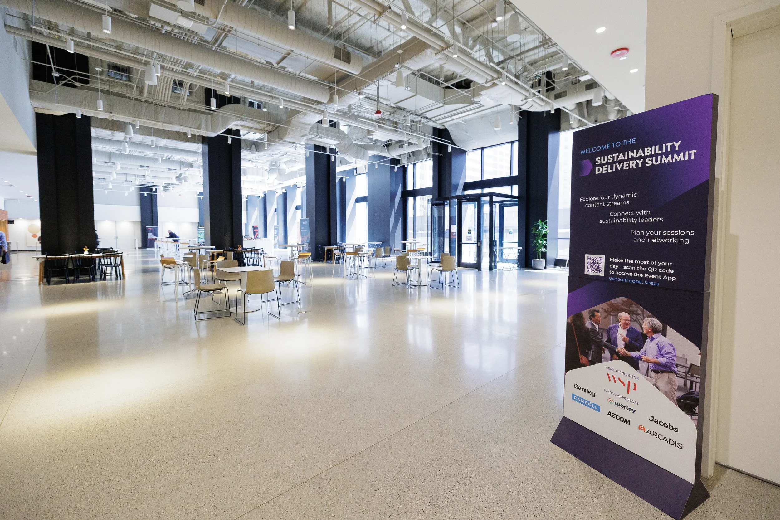 Wide view of conference lobby with welcome signage at Orlando corporate conference venue