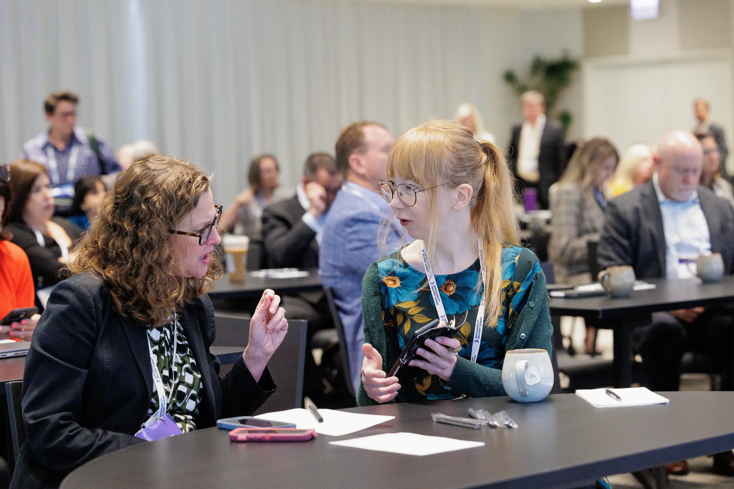 Attendees converse while seated during break at Chicago industry conference