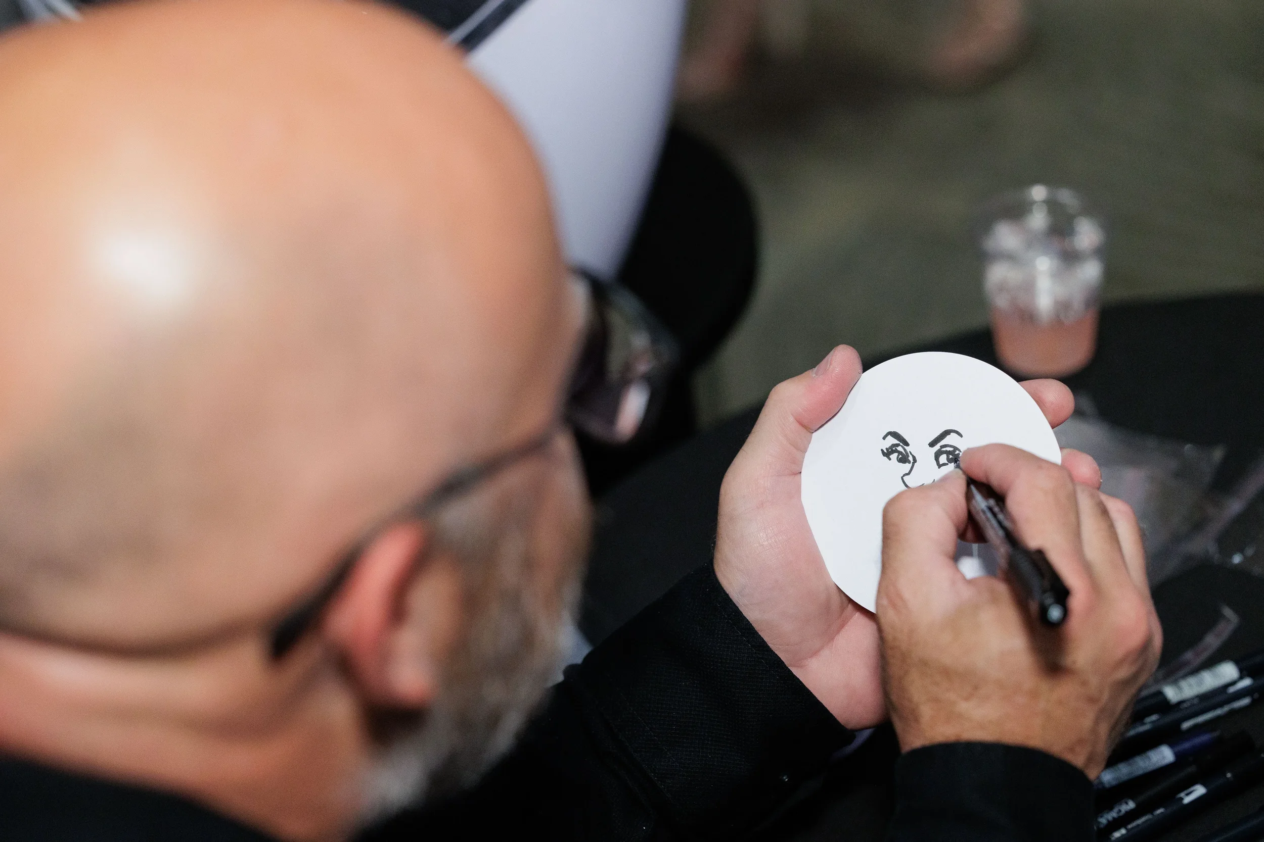 Artist draws close-up caricature portrait at Chicago corporate conference gala event