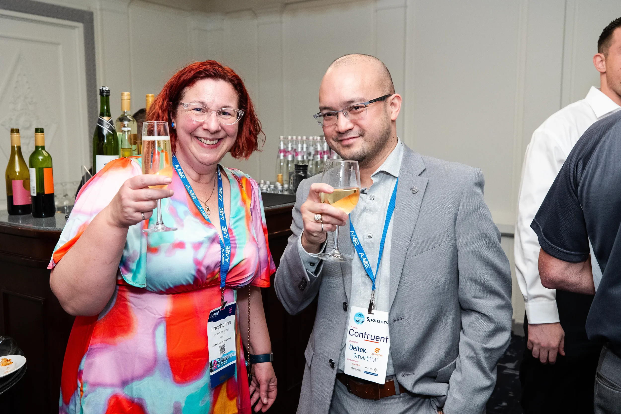 Conference attendees raise glasses at AACE International networking reception in Orlando