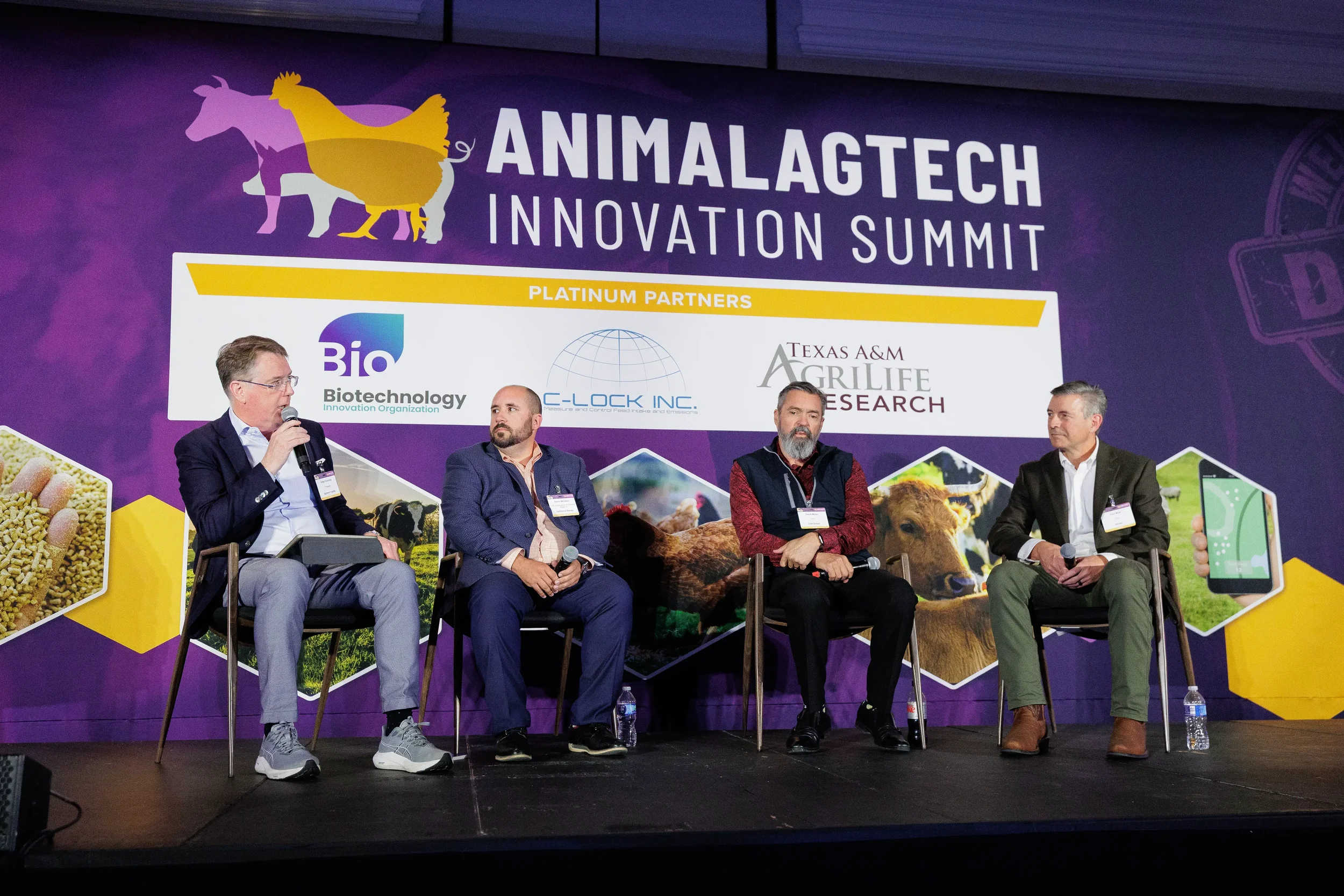 Four panelists discuss on branded stage during session at Chicago corporate summit