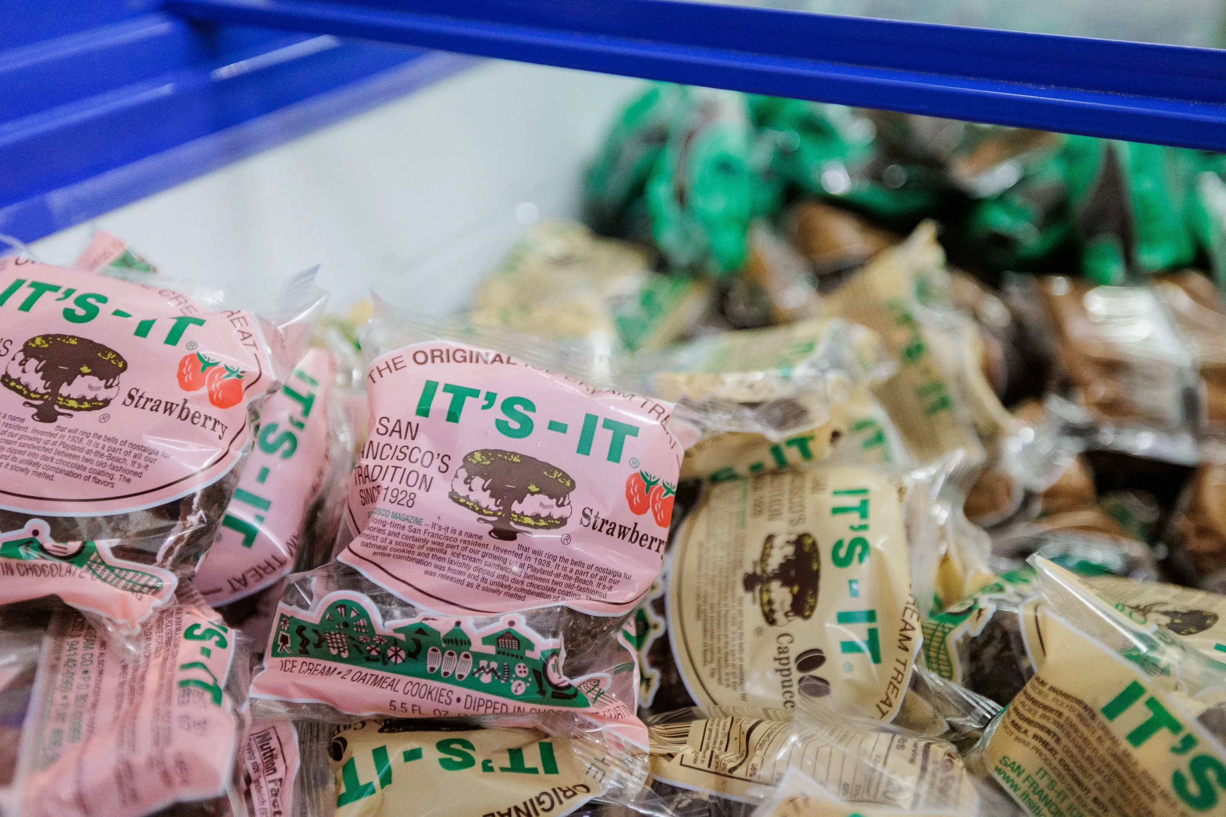 Assorted packaged ice cream treats displayed in bin at Orlando industry conference catering station