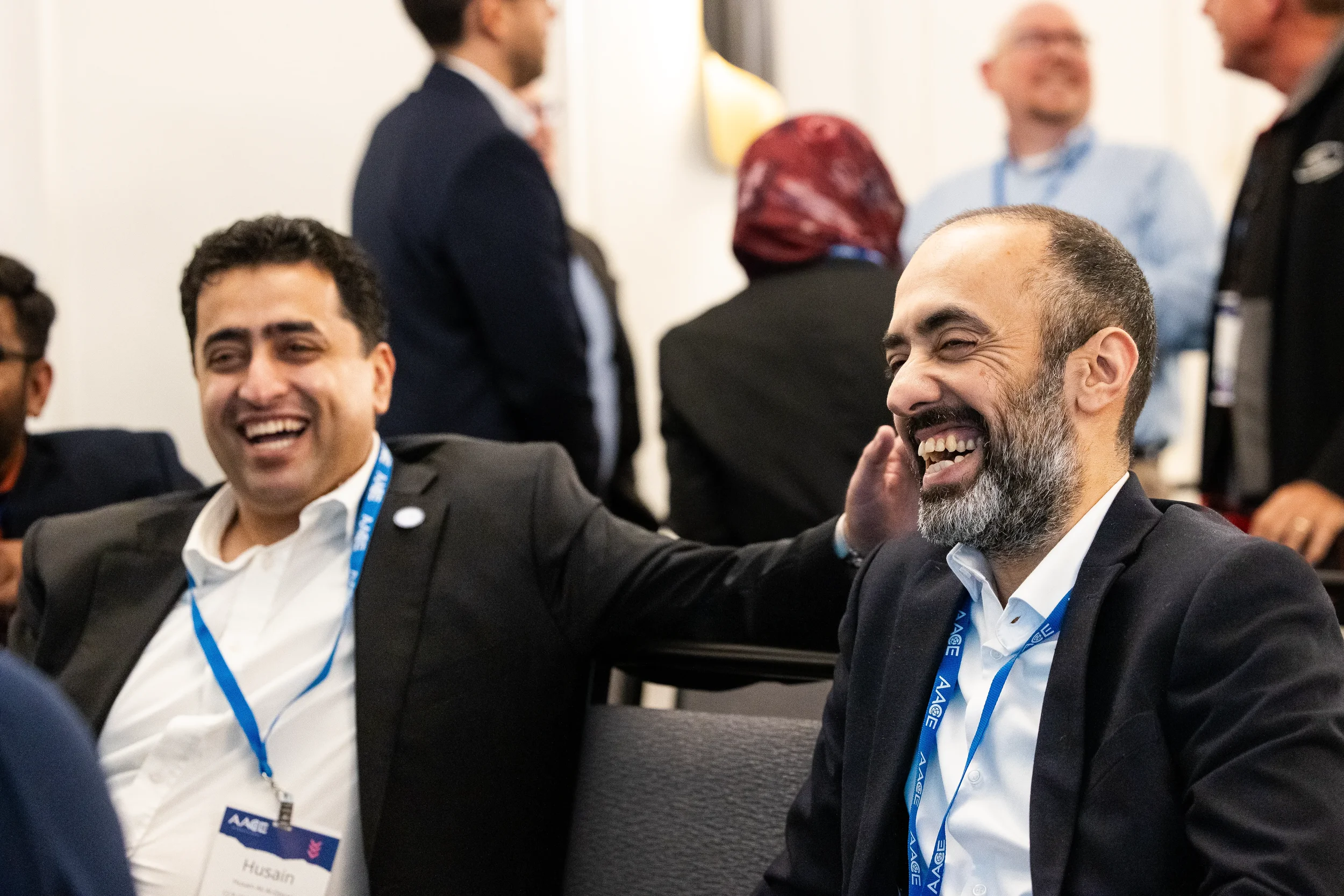 Two colleagues share a laugh during AACE International networking event in Chicago