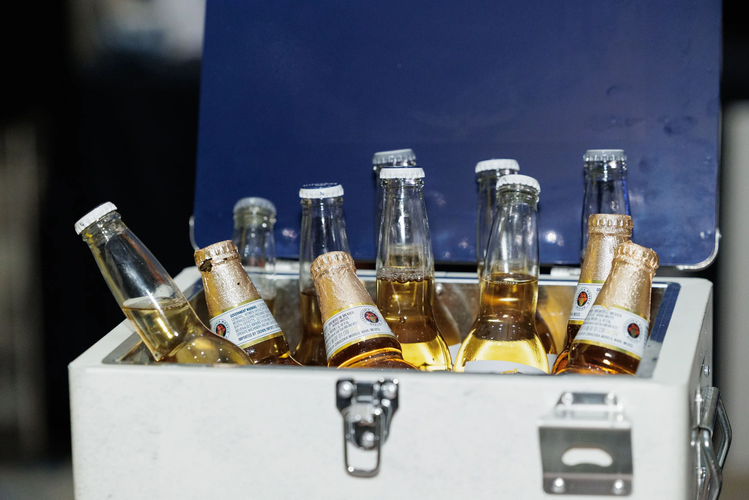Chilled beer bottles packed in open cooler at Orlando corporate conference networking reception