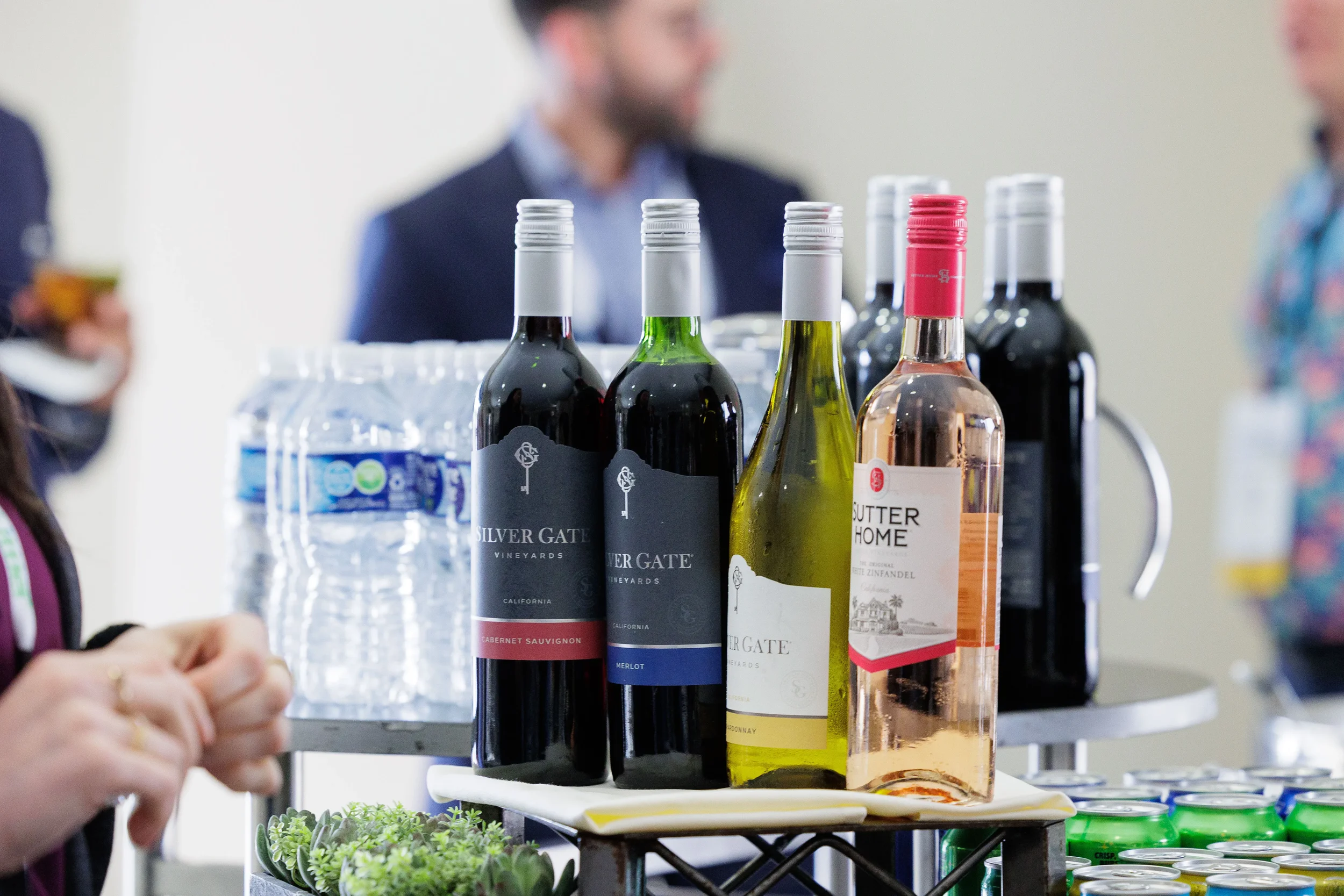 Assorted wine bottles displayed at beverage station during Chicago corporate conference networking reception