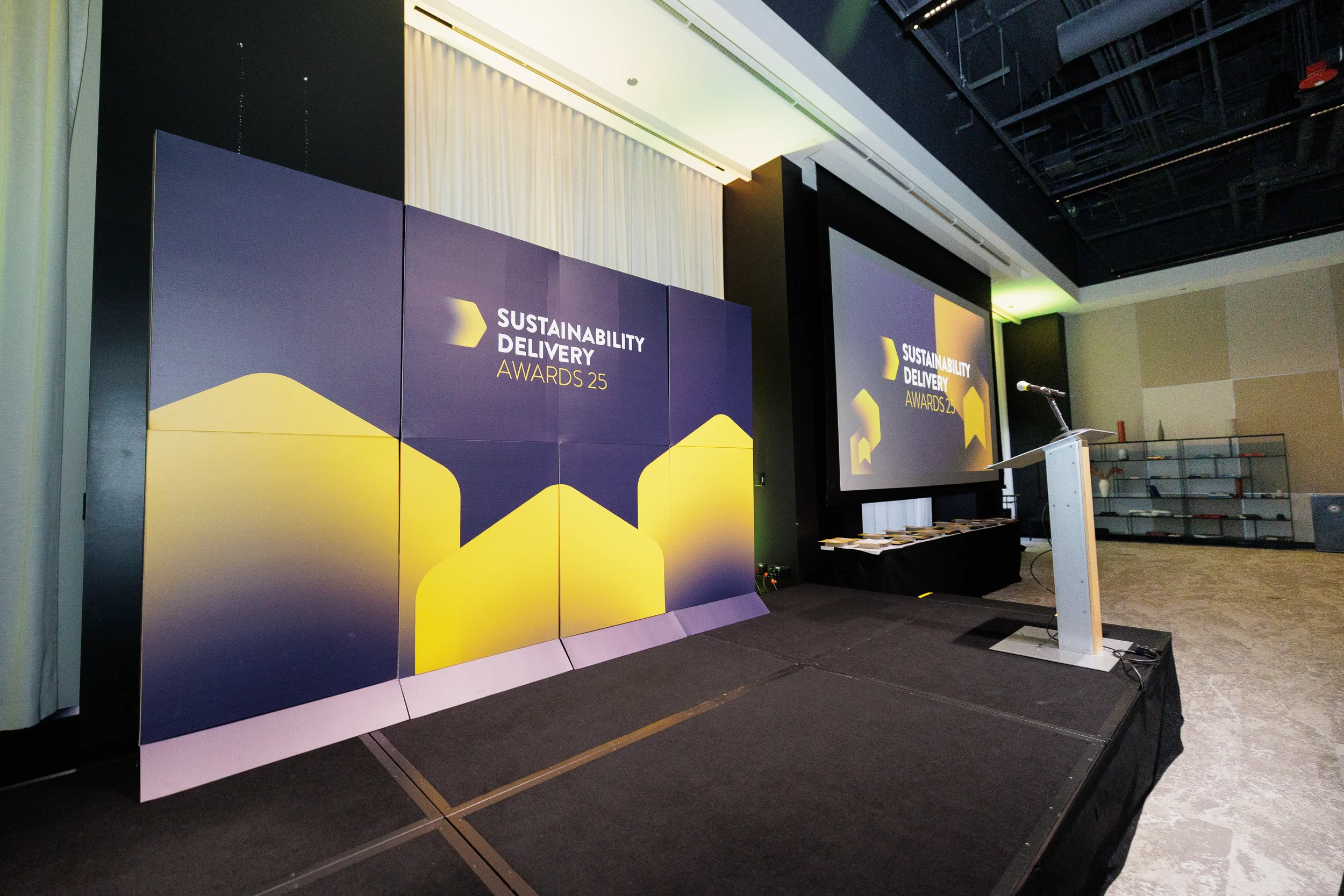 Awards stage set with podium and branded backdrop ahead of Chicago corporate ceremony