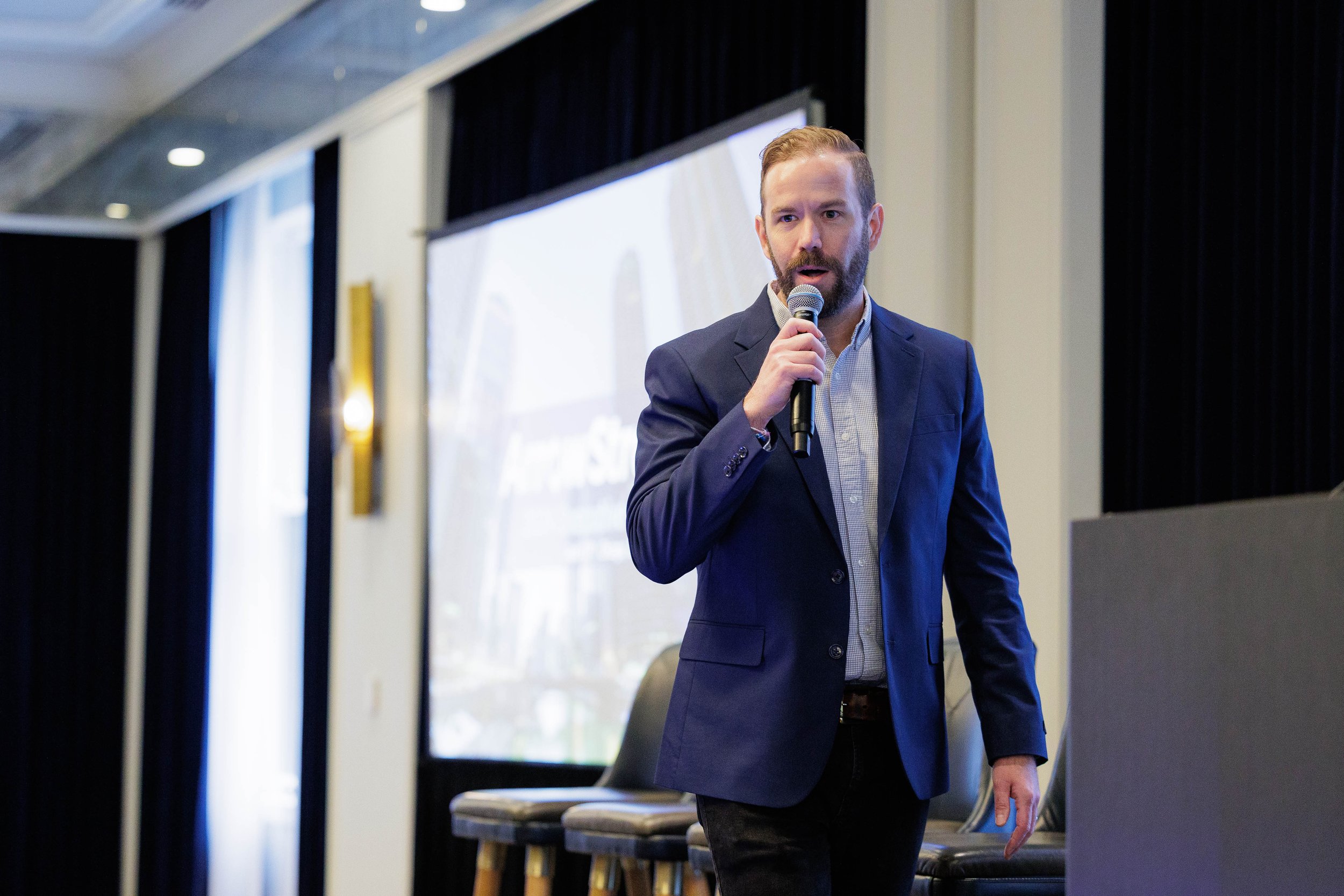Keynote speaker addressing audience during a professional conference presentation in Chicago