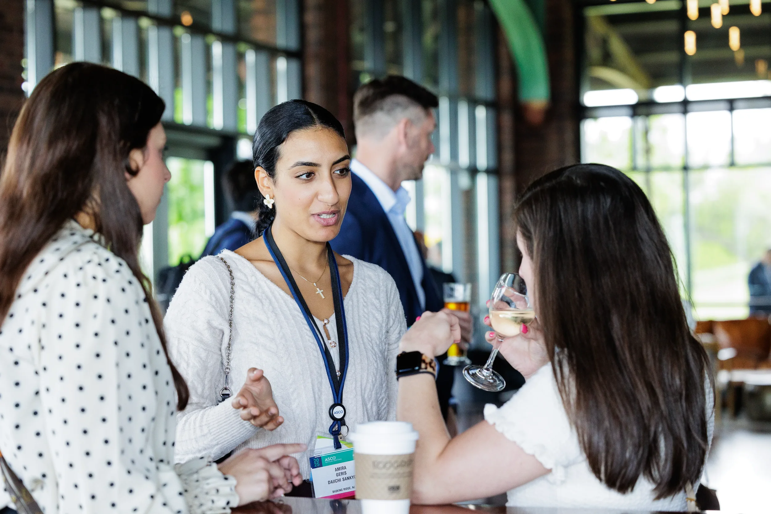 Attendees network over drinks on outdoor patio during Chicago corporate event reception