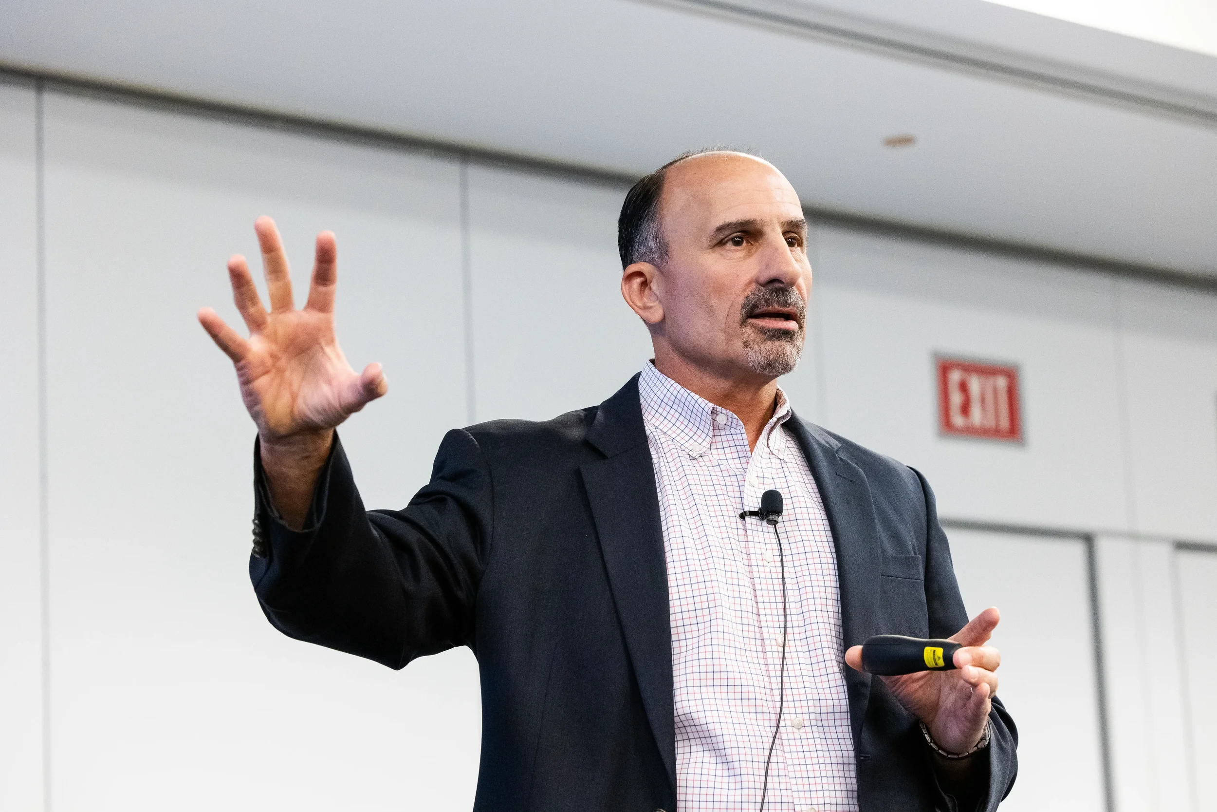 Chicago corporate event speaker gesturing expressively while