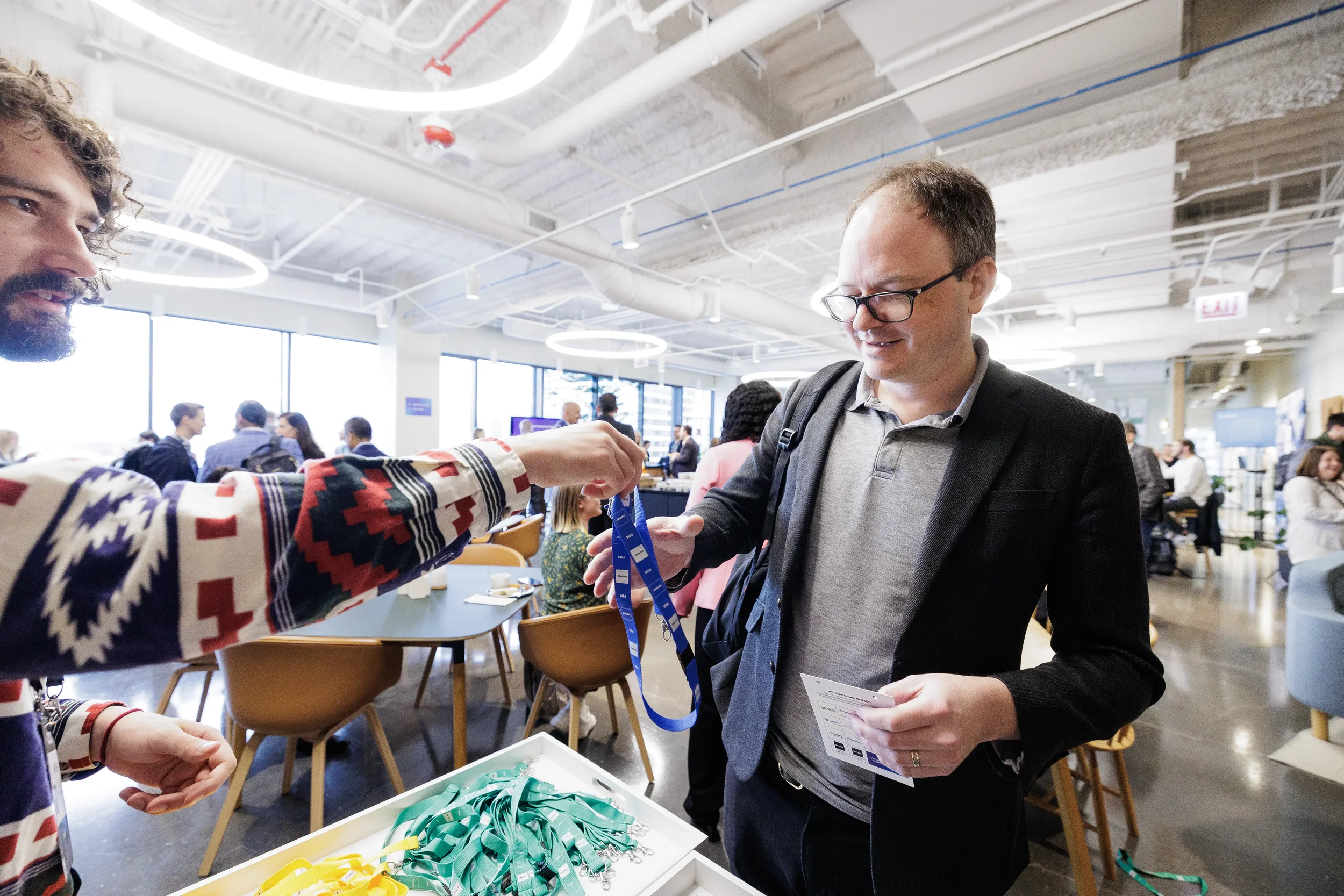 Attendee receives lanyard at registration check-in during Orlando corporate event