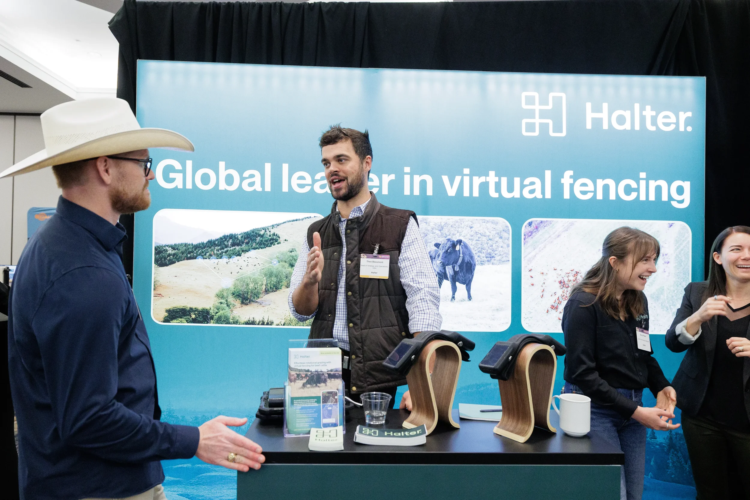 Exhibitor presents product display to attendees at booth during Chicago industry conference