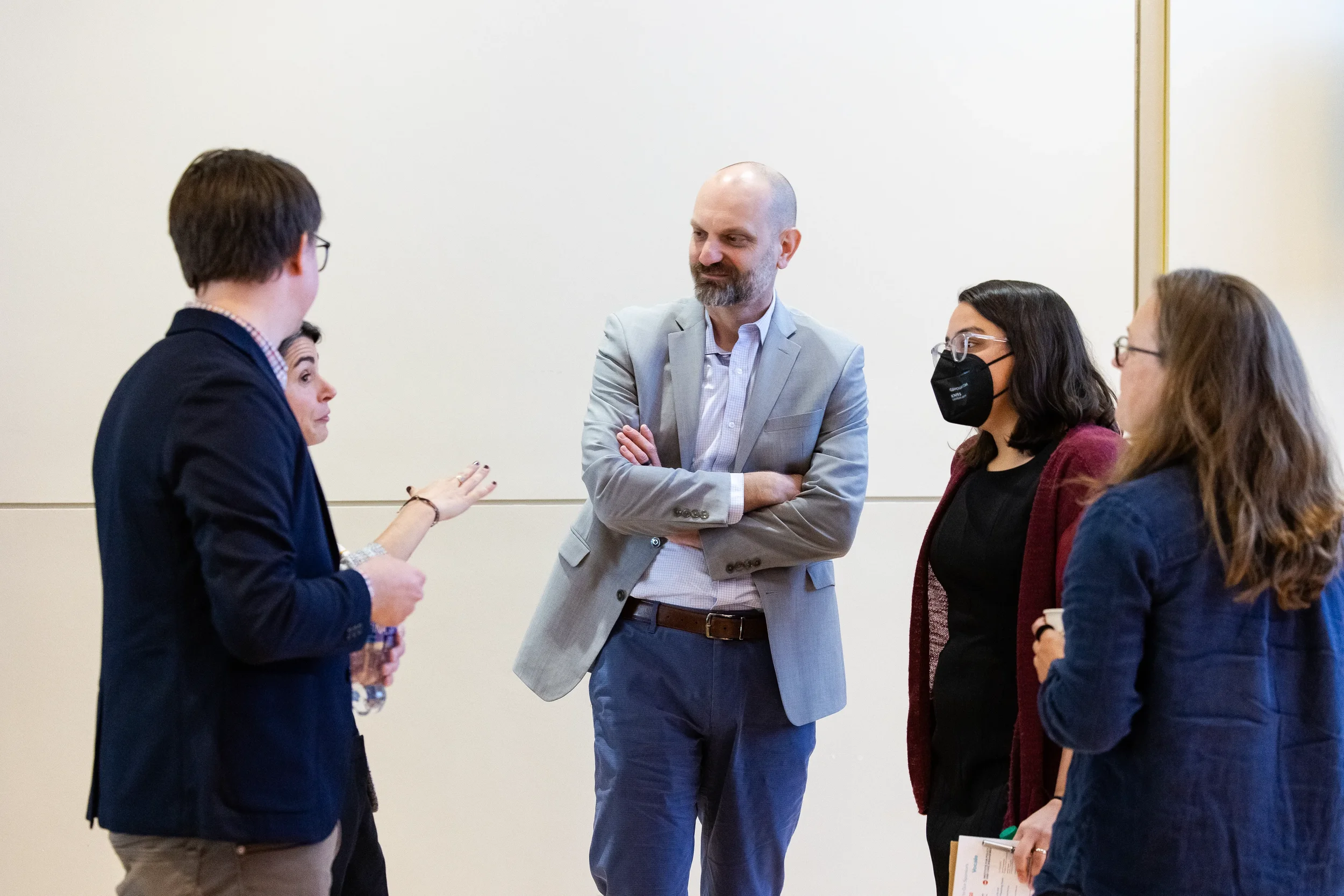 Attendees engage in conversation during networking break at Chicago industry conference
