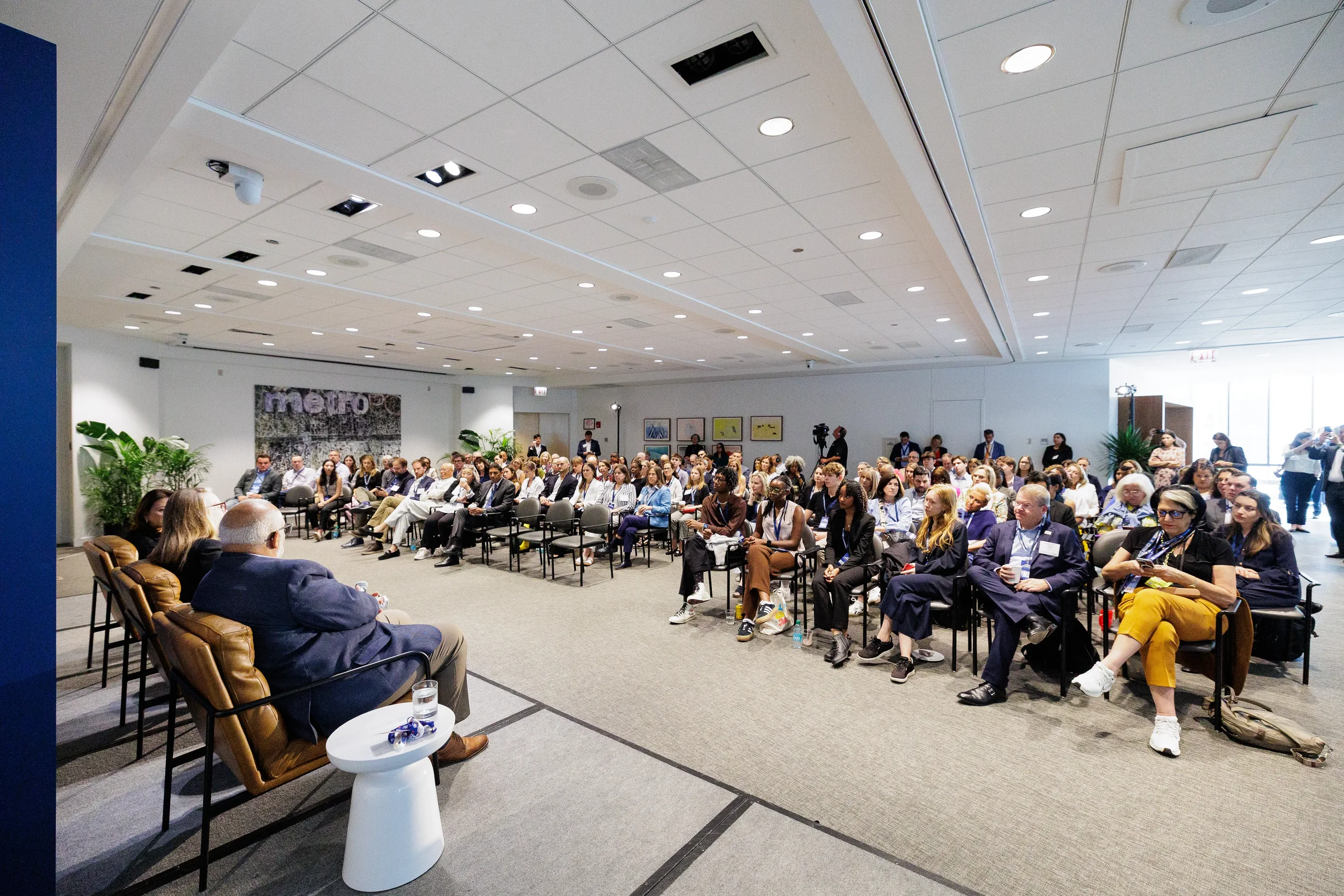 Wide view of seated audience during general session at Chicago corporate conference event