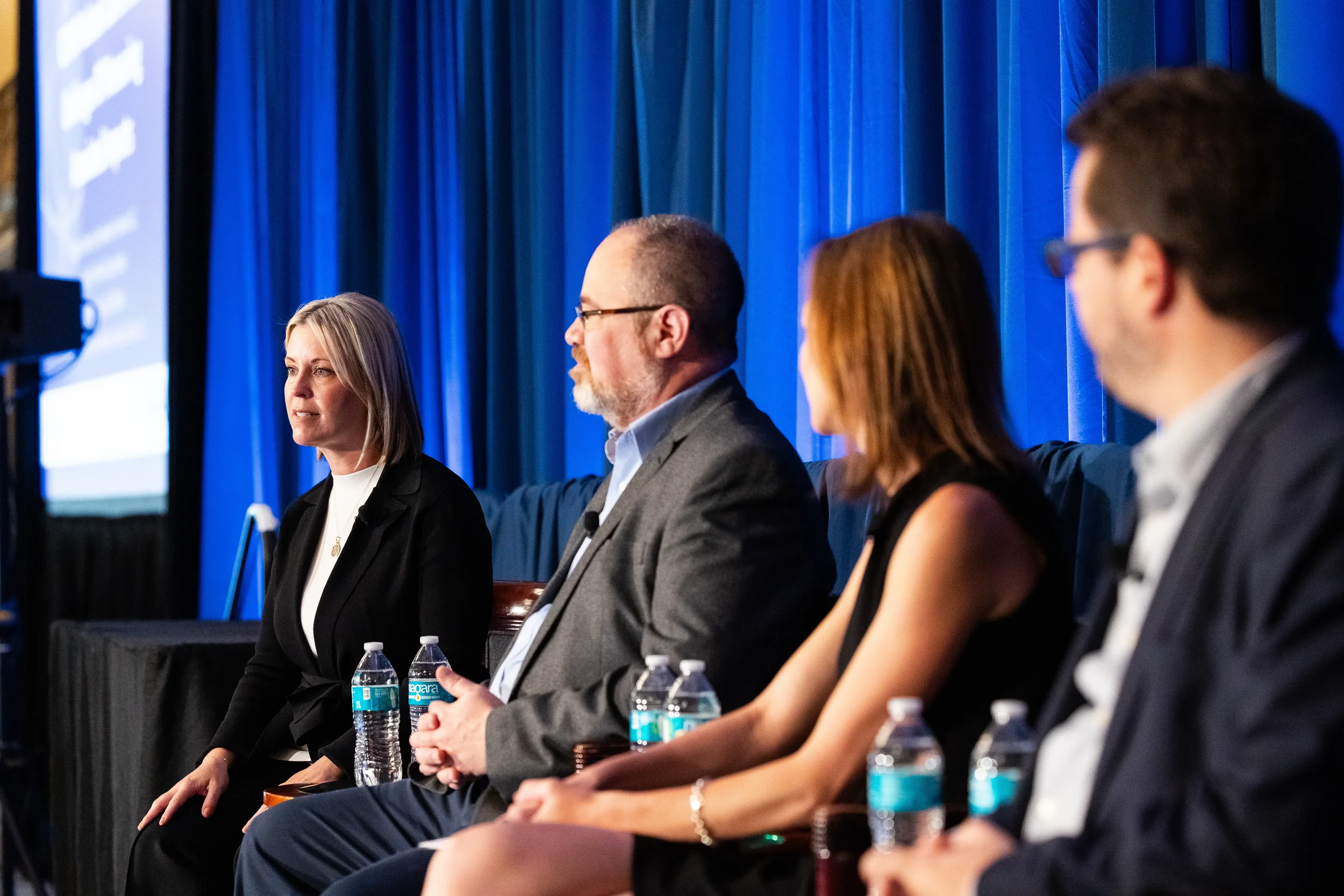Expert panelists discuss industry topics during breakout session at a conference in Orlando