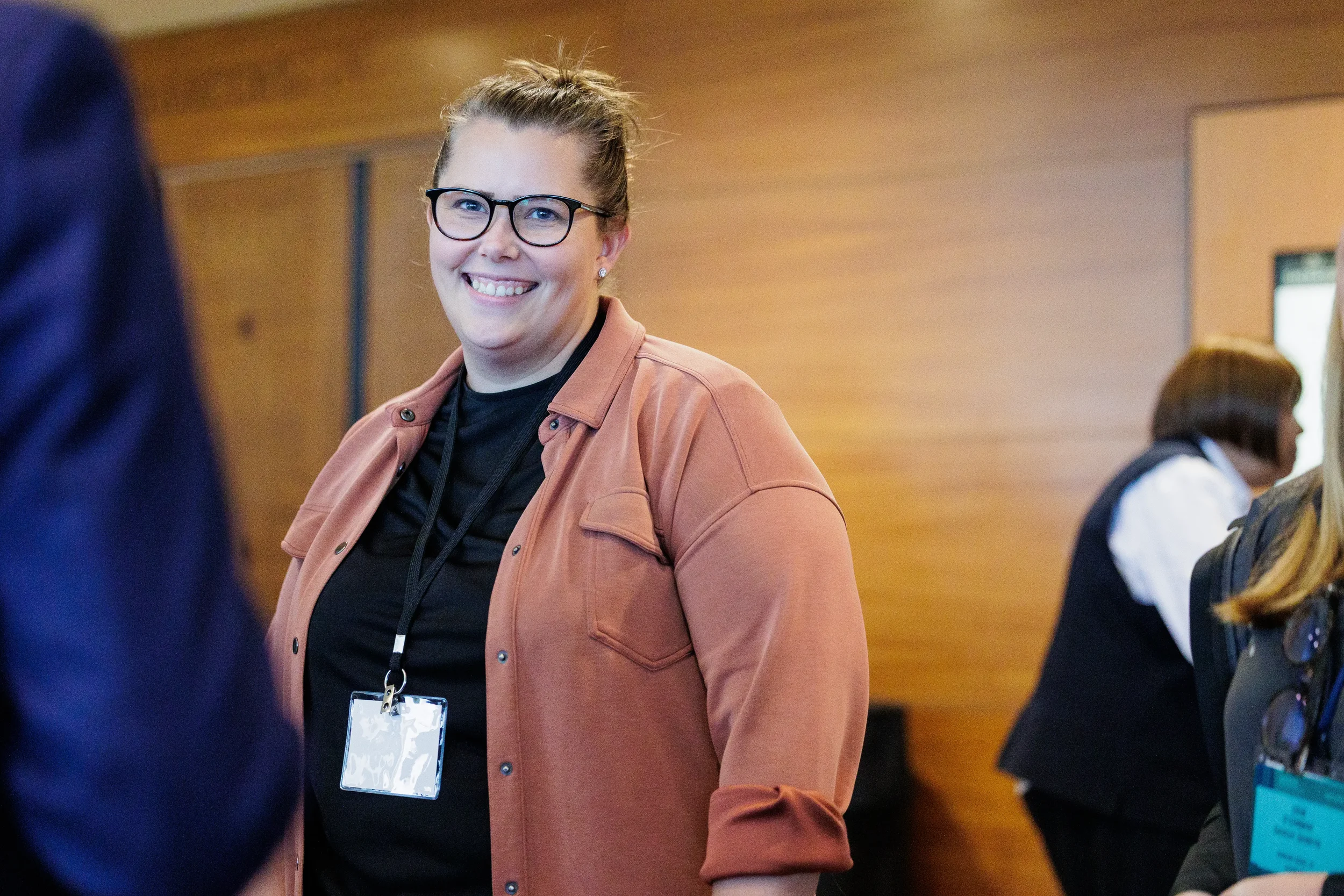 Attendee smiles while attending Orlando industry conference reception