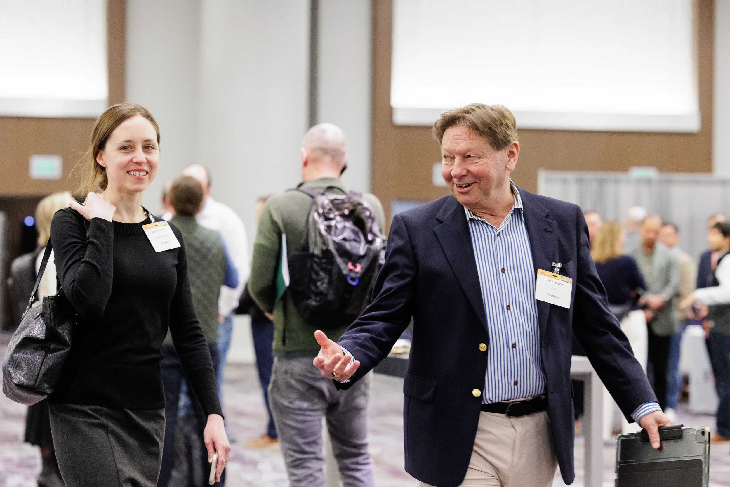 Attendees greet each other while networking at Chicago corporate conference expo floor