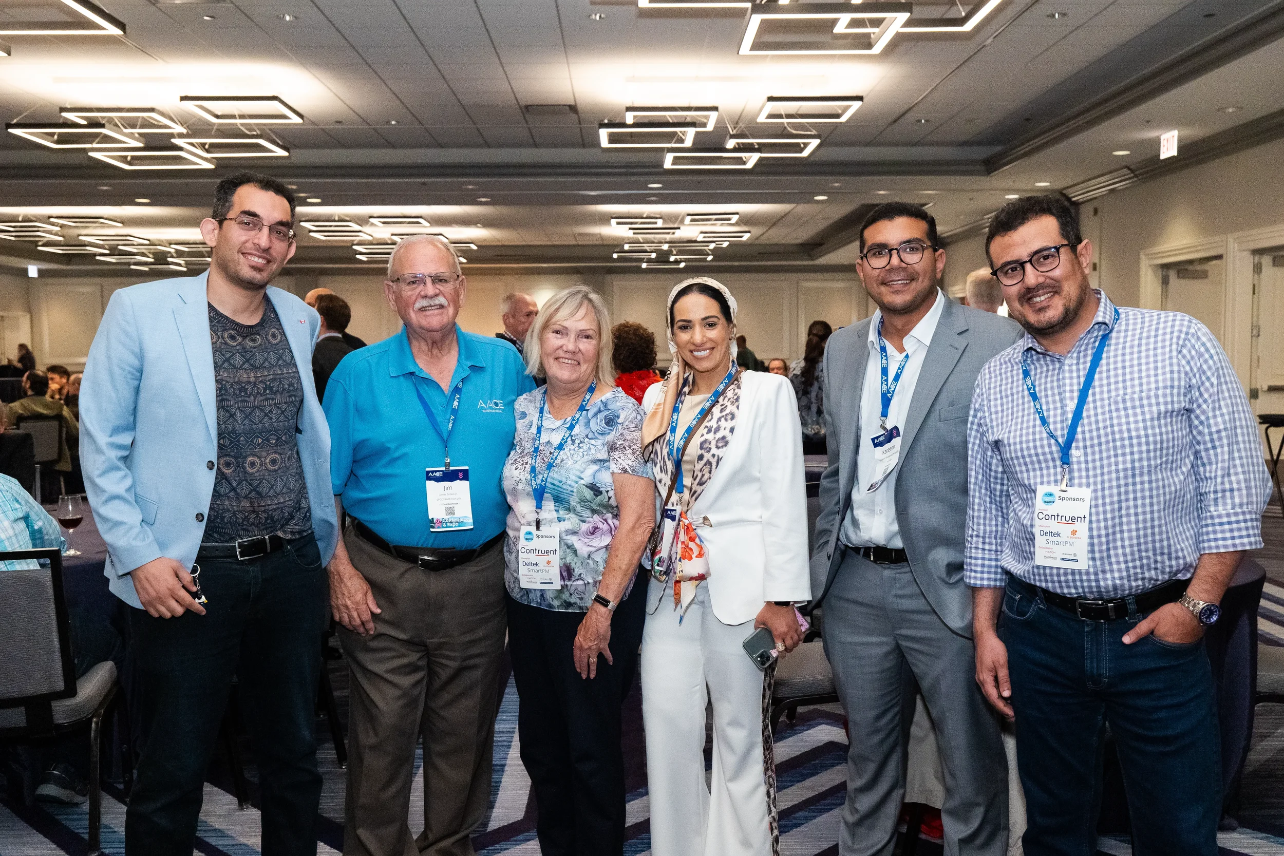 Six attendees pose together during reception at Chicago corporate conference event