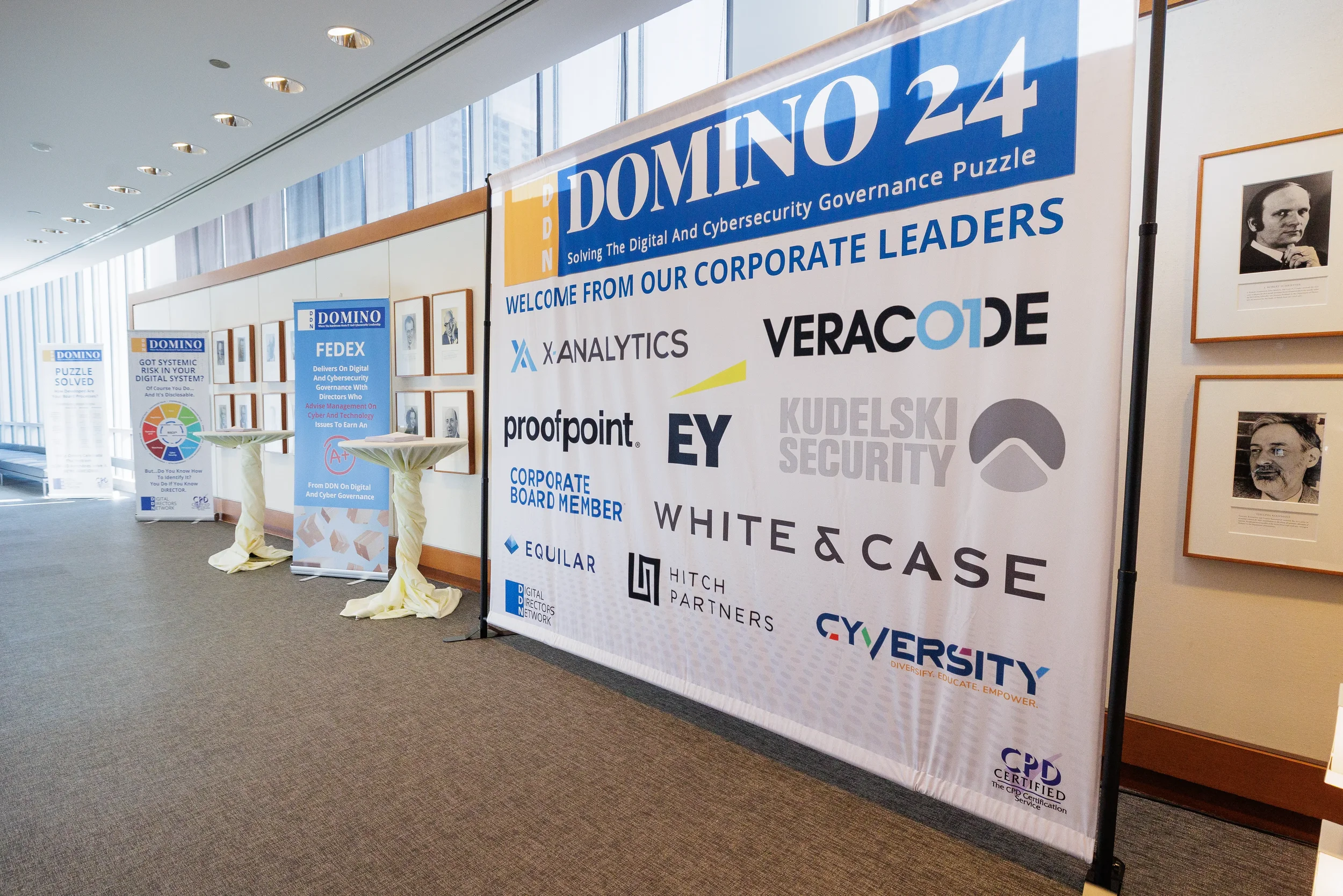 Large sponsor and corporate leaders banner displayed in hallway at Orlando industry conference venue