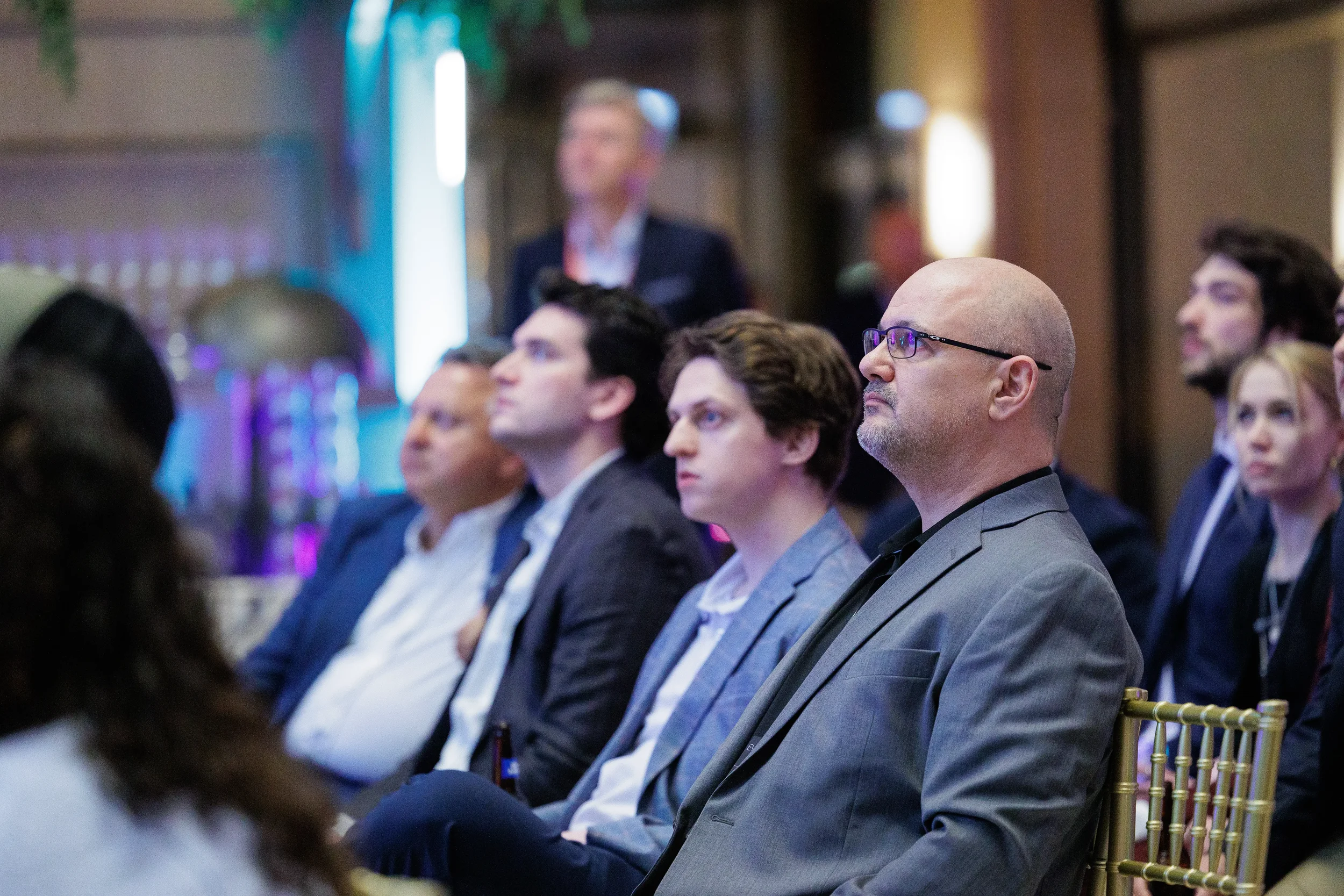 Attendees seated in rows watching a presentation at Orlando industry conference