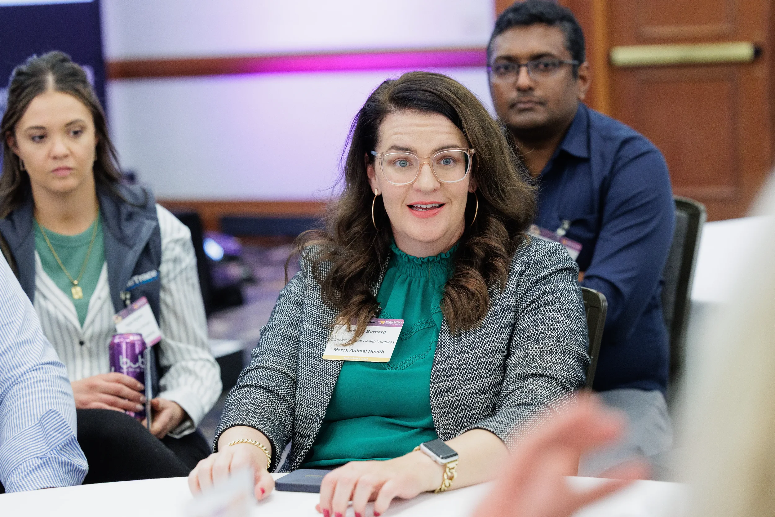 Attendee speaks during roundtable discussion session at Chicago corporate conference