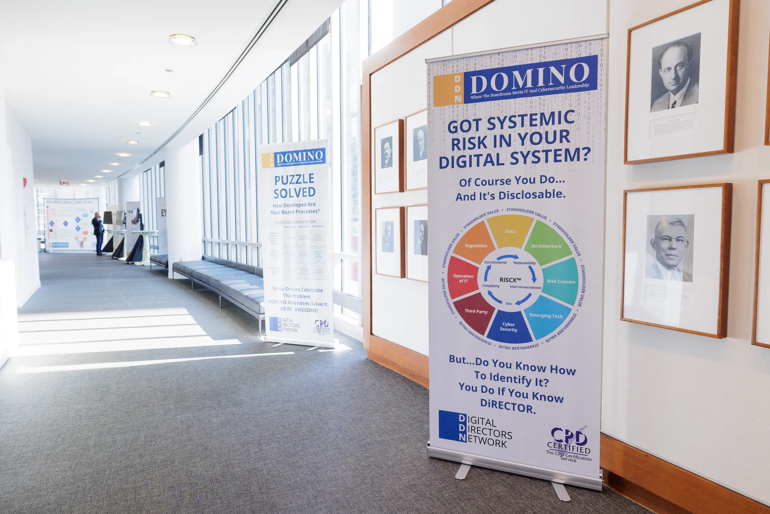 Branded conference signage and banners displayed in hallway at Orlando industry corporate event