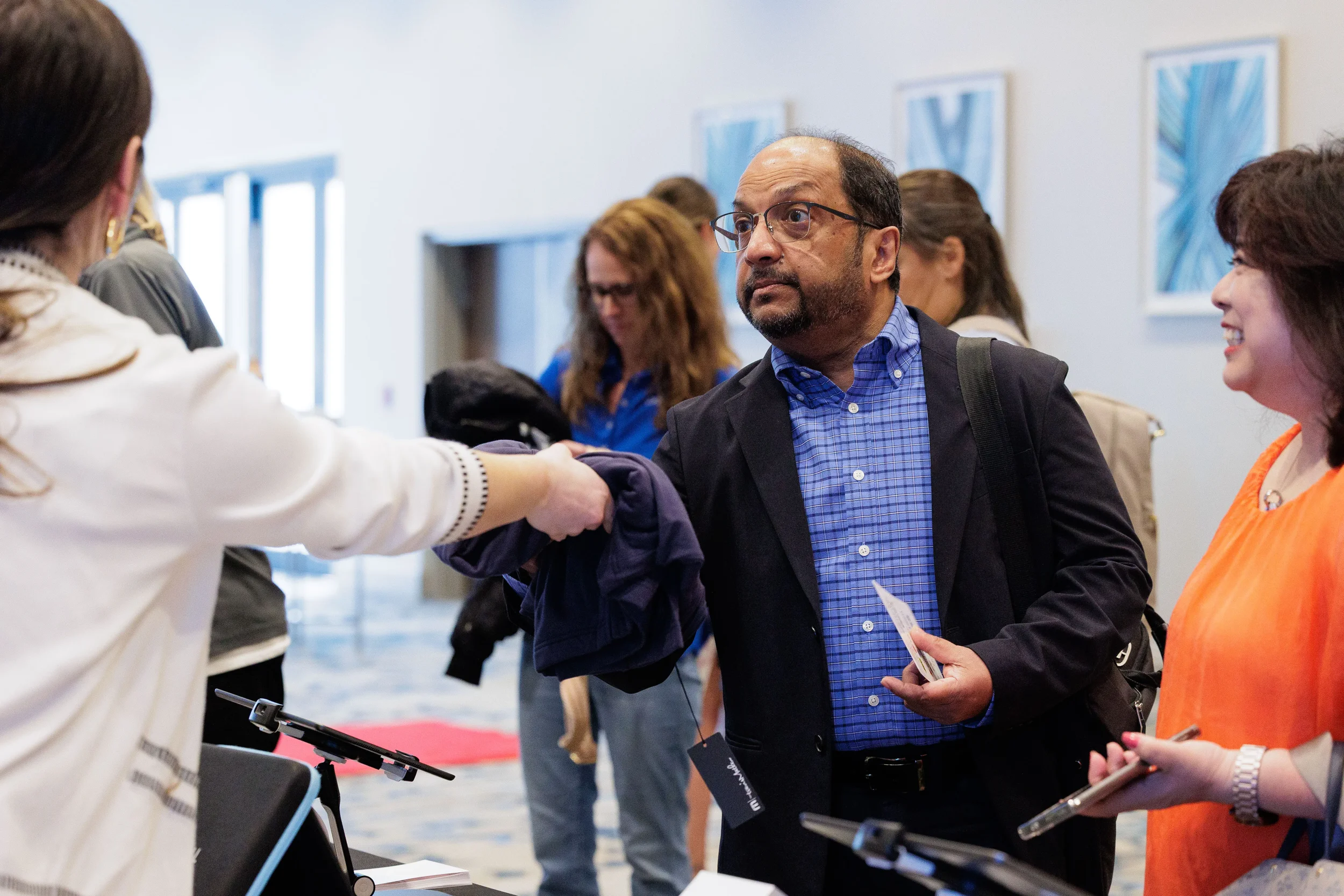 Attendee checks in at registration table during Chicago corporate conference arrival