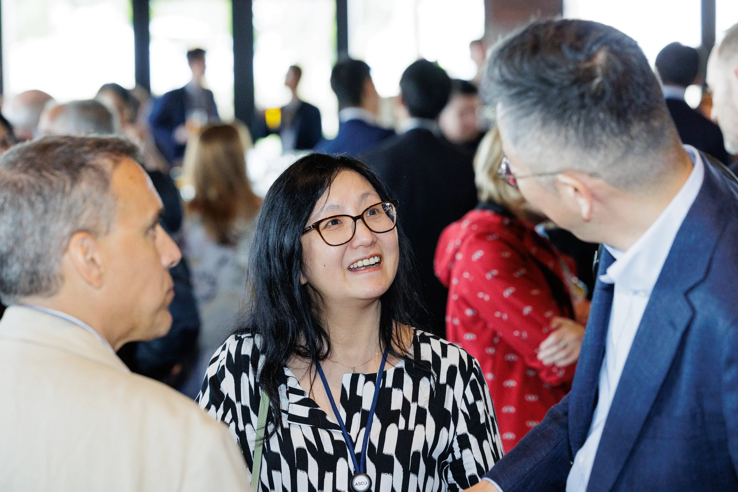 Attendees engage in conversation during networking reception at Chicago industry event