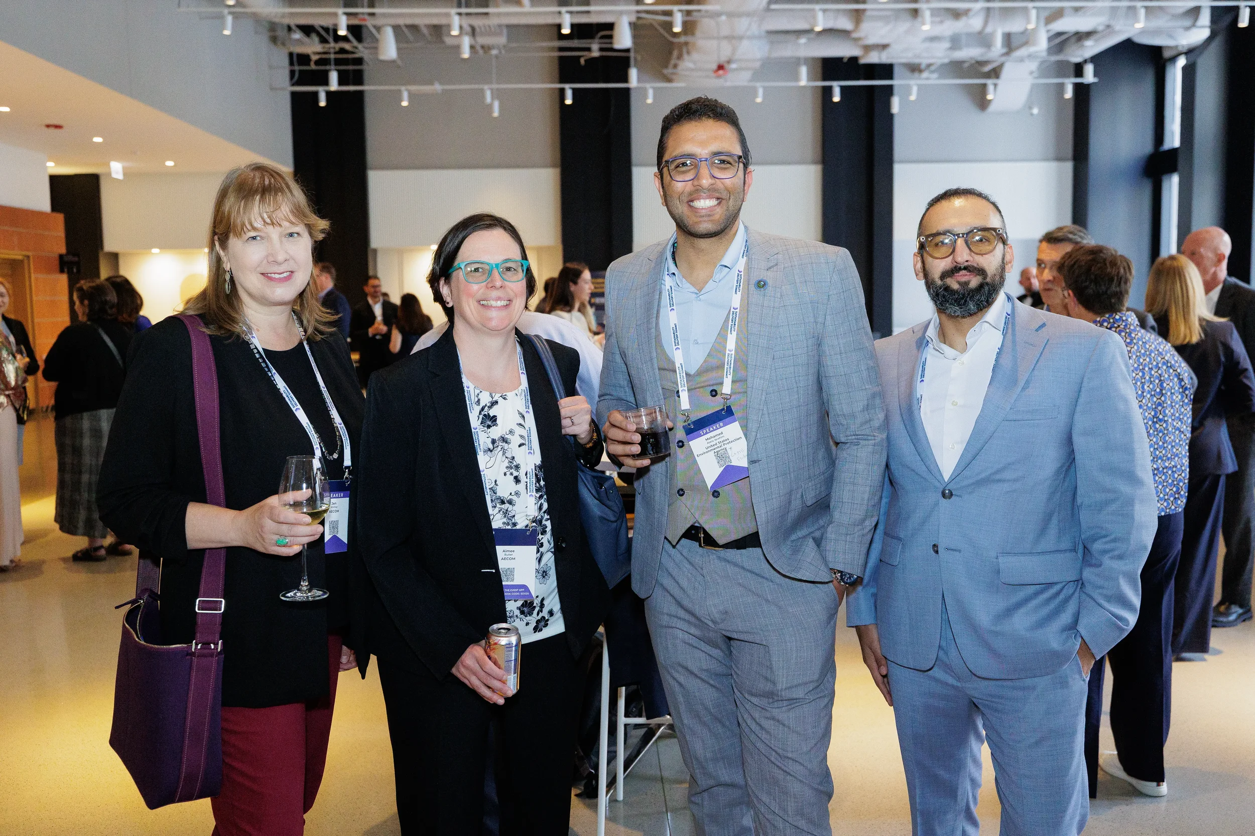 Group of attendees pose together smiling during Chicago corporate event reception