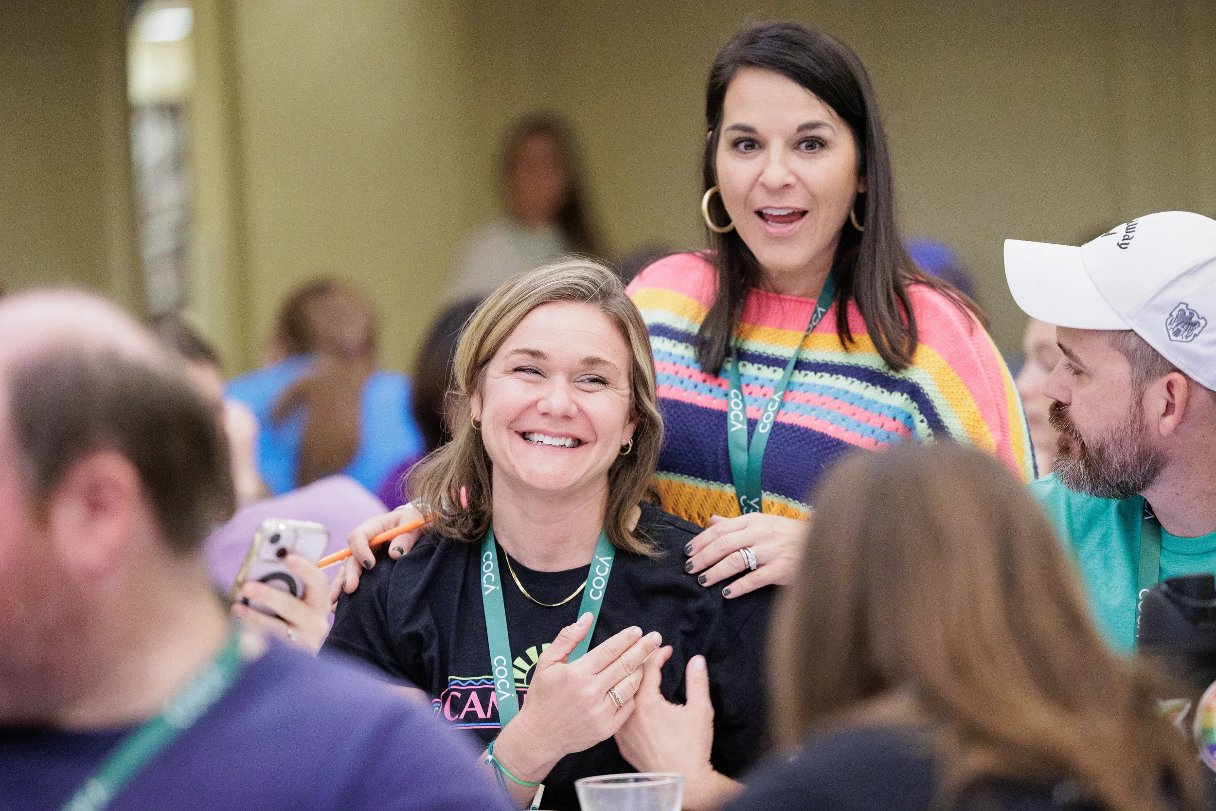 Two attendees share a laugh together at Chicago nonprofit conference event